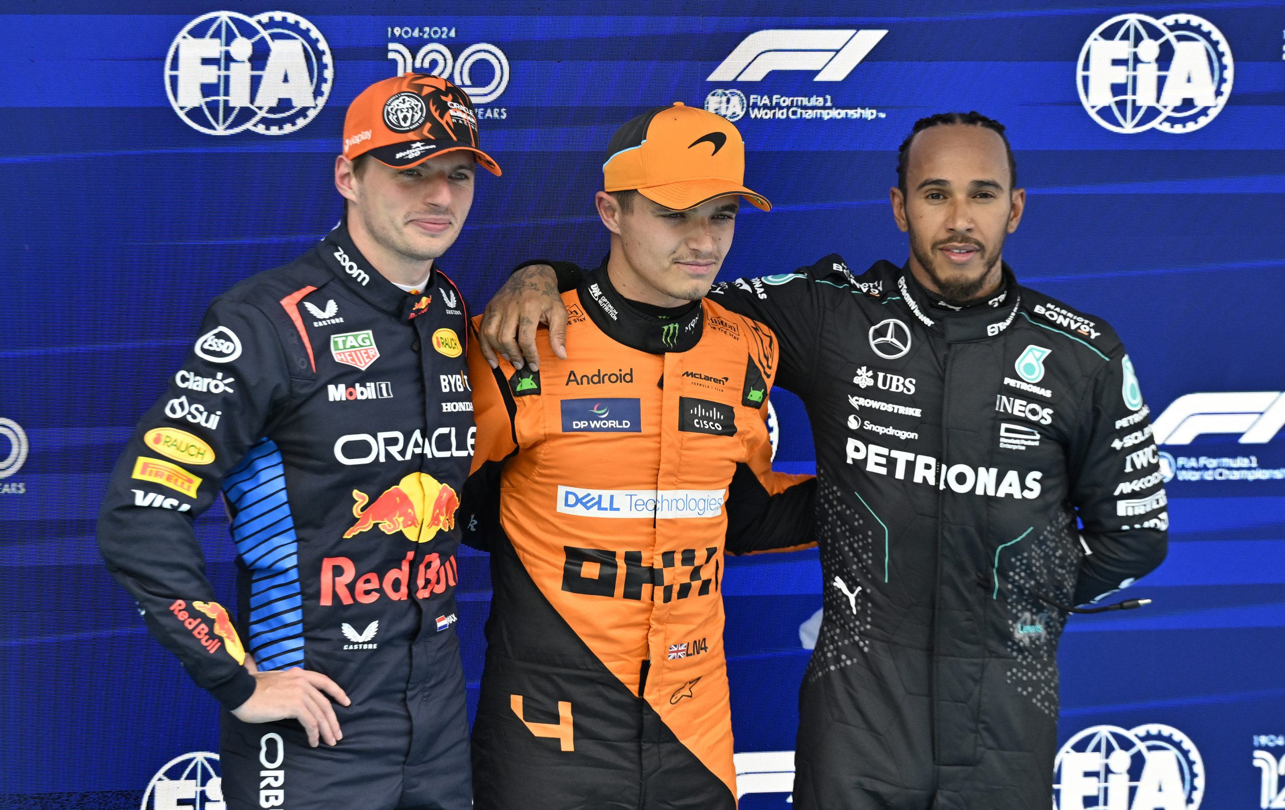 Pole position winner Lando Norris (middle) with Max Verstappen (left) and Lewis Hamilton (right).