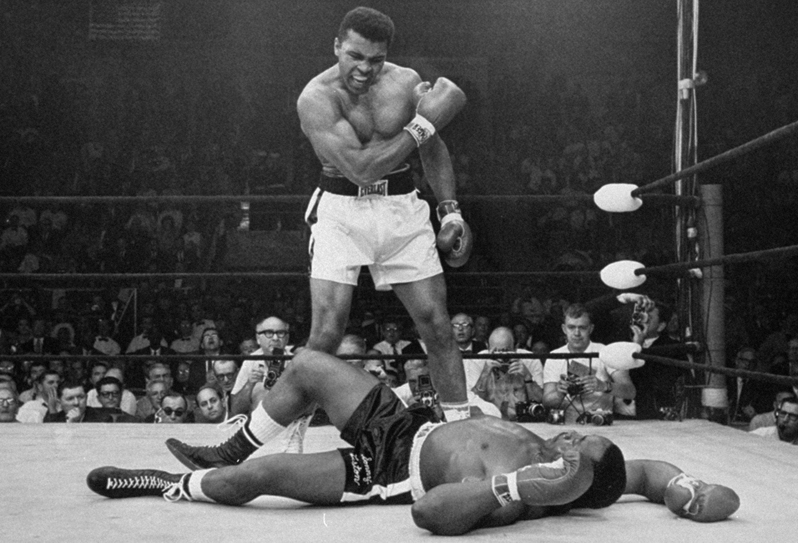 Muhammad Ali standing over Sonny Liston in his 1964 world title victory.