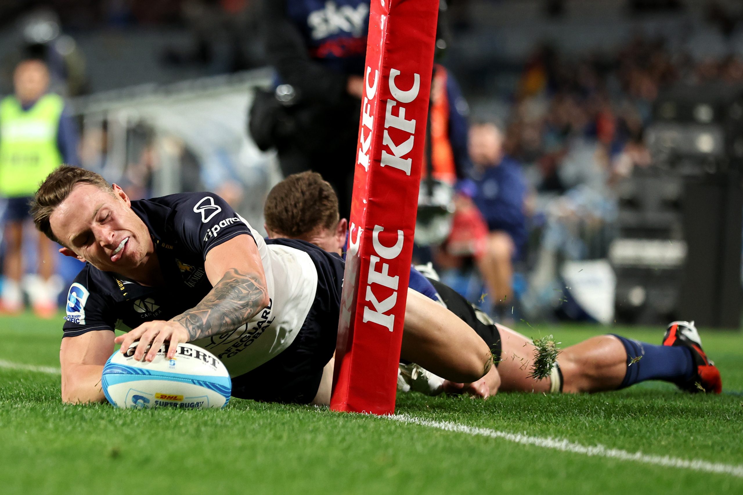 Dalton Papali'i of the Blues tackles Corey Toole of the Brumbies preventing him from scoring a try during the Super Rugby Pacific semi-final.