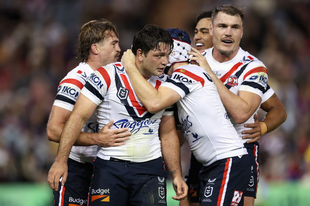 Brandon Smith celebrates scoring a try with team mates.