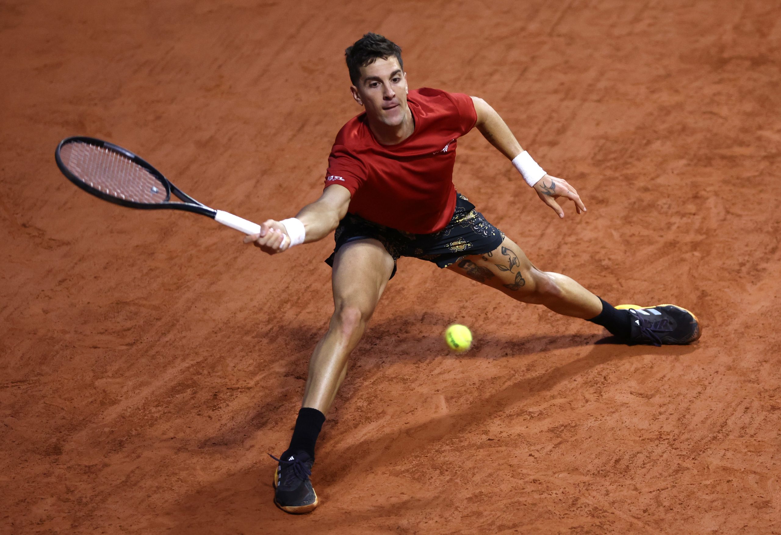 Thanasi Kokkinakis of Australia plays a forehand against Taylor Fritz of United States in the Men's Singles third round match during Day Seven of the 2024 French Open at Roland Garros on June 01, 2024 in Paris, France. (Photo by Dan Istitene/Getty Images)