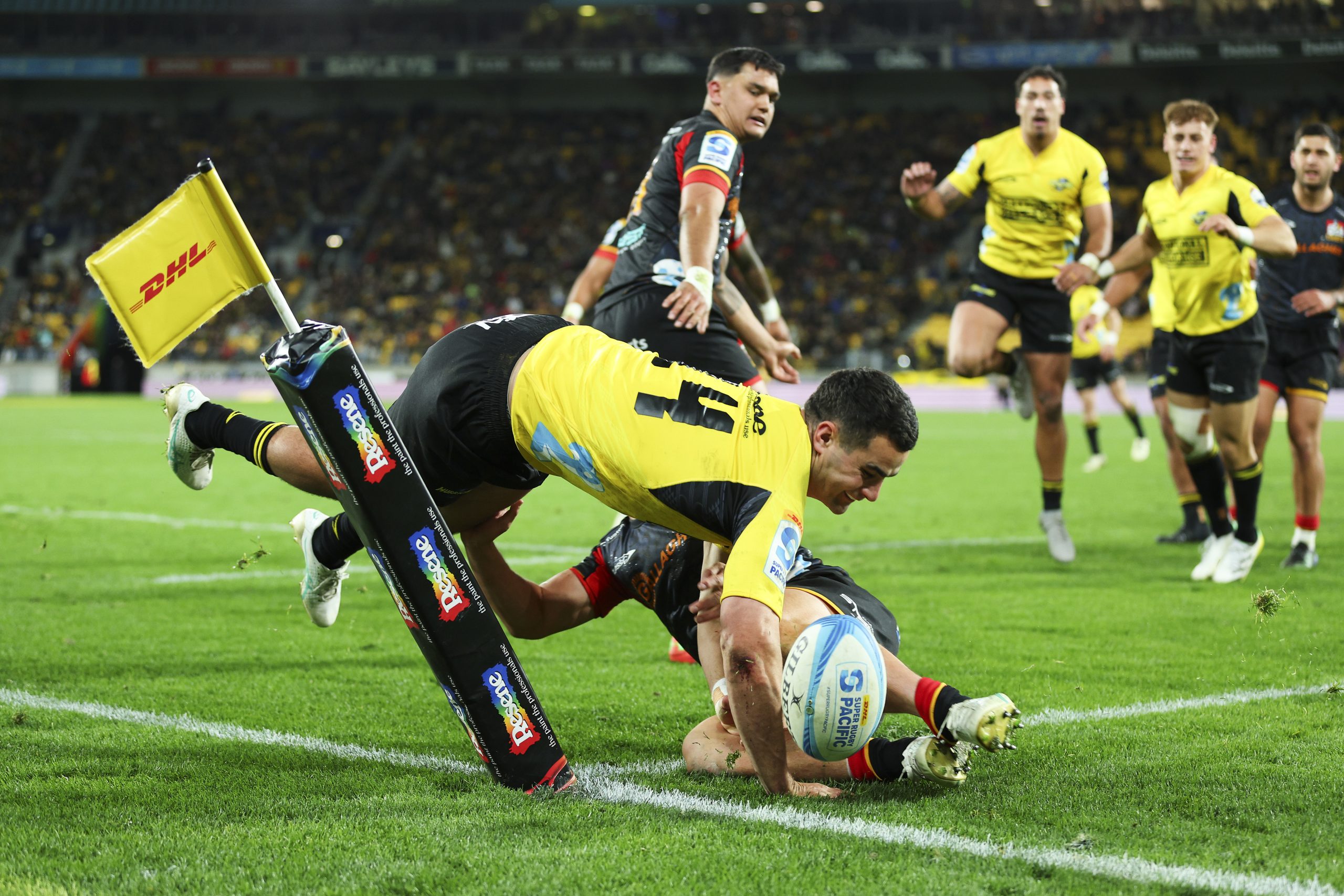 Josh Moorby of the Hurricanes loses control of the ball during the Super Rugby Pacific semi-final. 