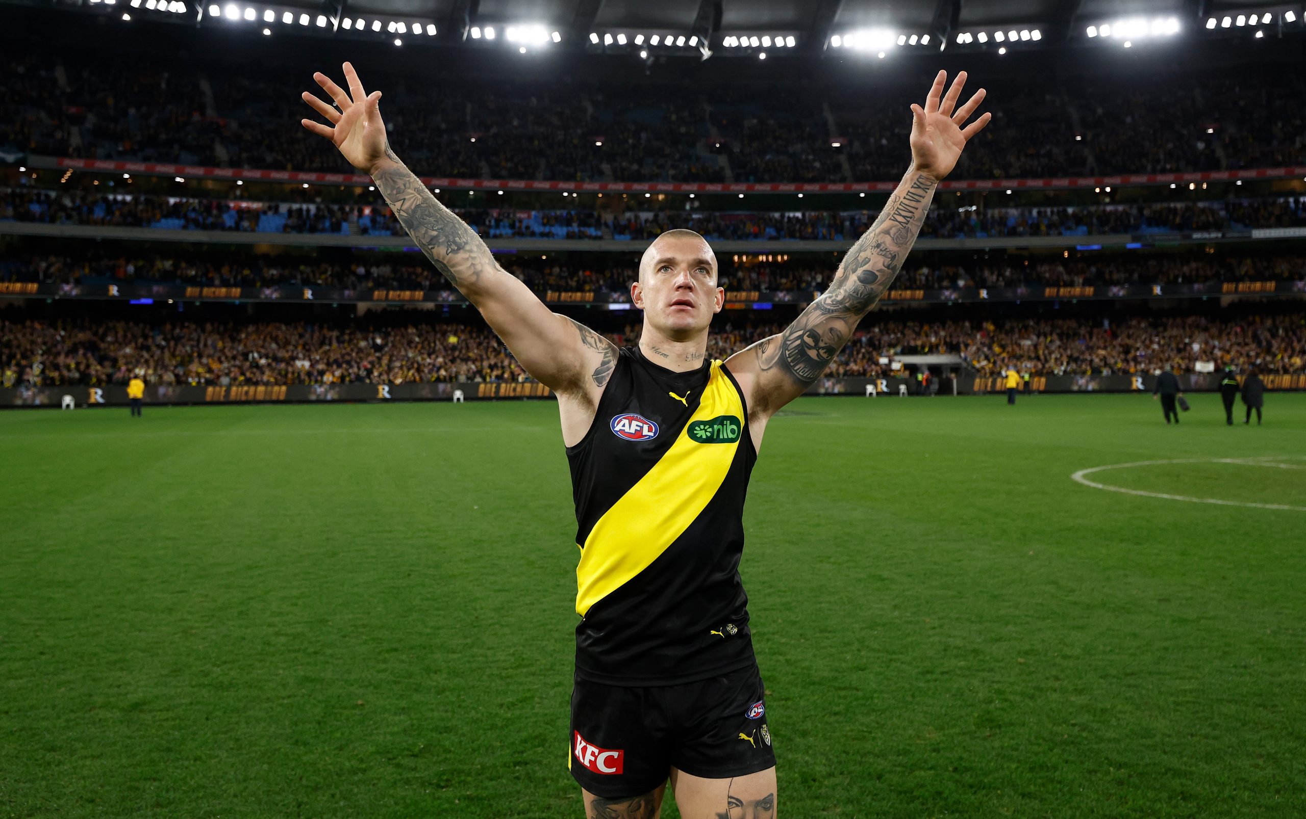 Dustin Martin of the Tigers recognises the crowd after his 300th game.