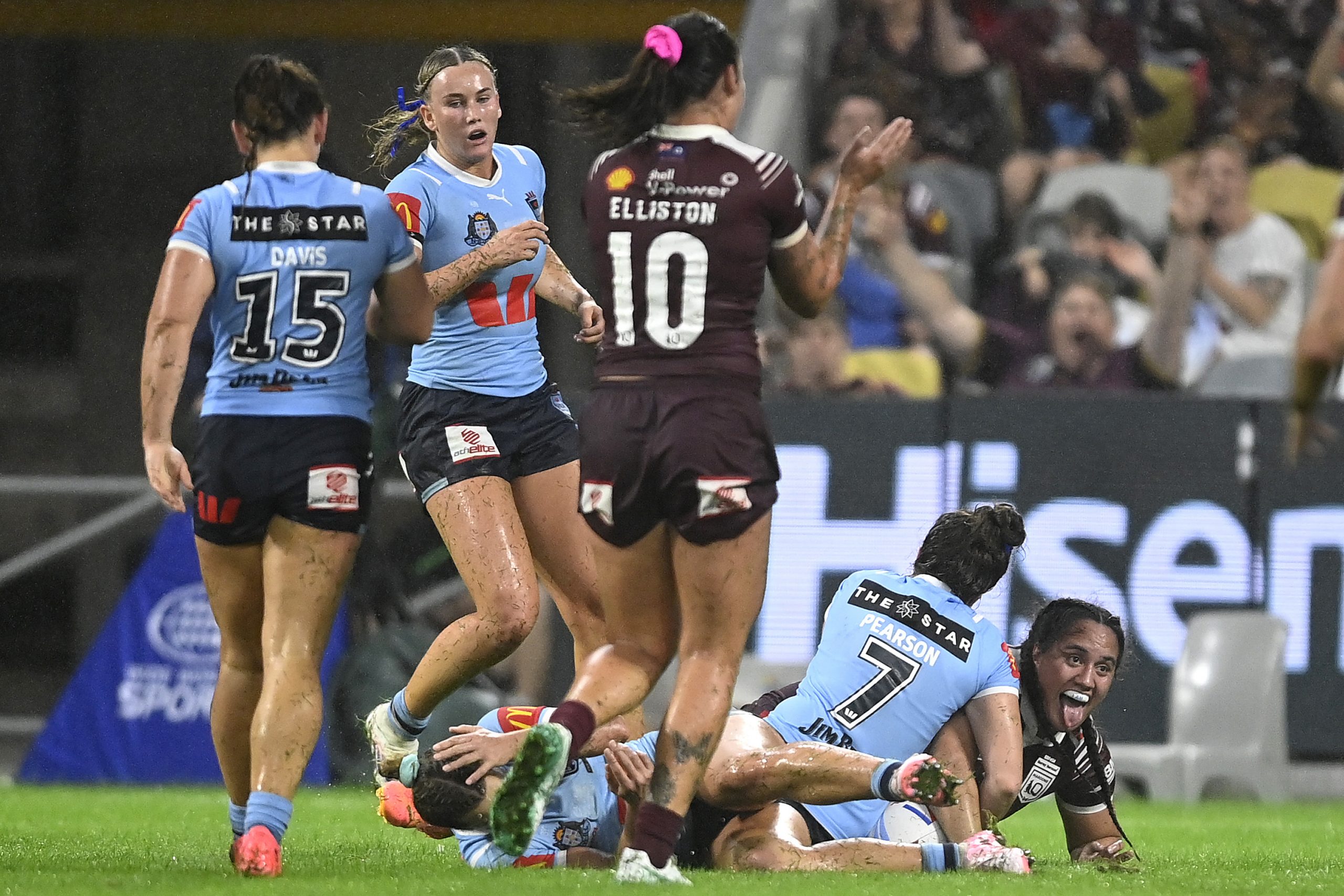 Tazmin Rapana of the Maroons celebrates with teammates after scoring a the match-winning try.