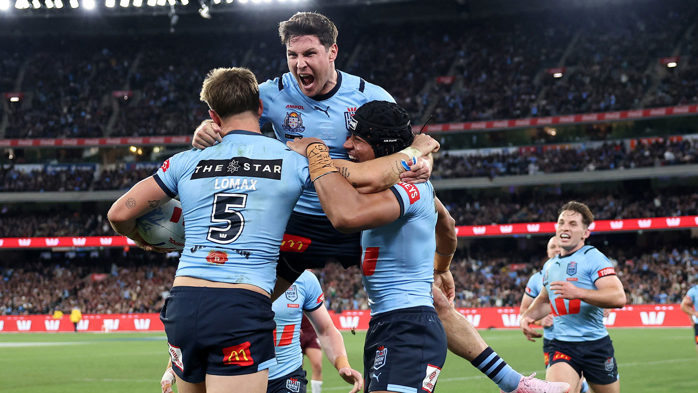 Mitchell Moses celebrates with Zac Lomax and Stephen Crichton after the NSW halfback out up a perfect kick for Lomax to score.