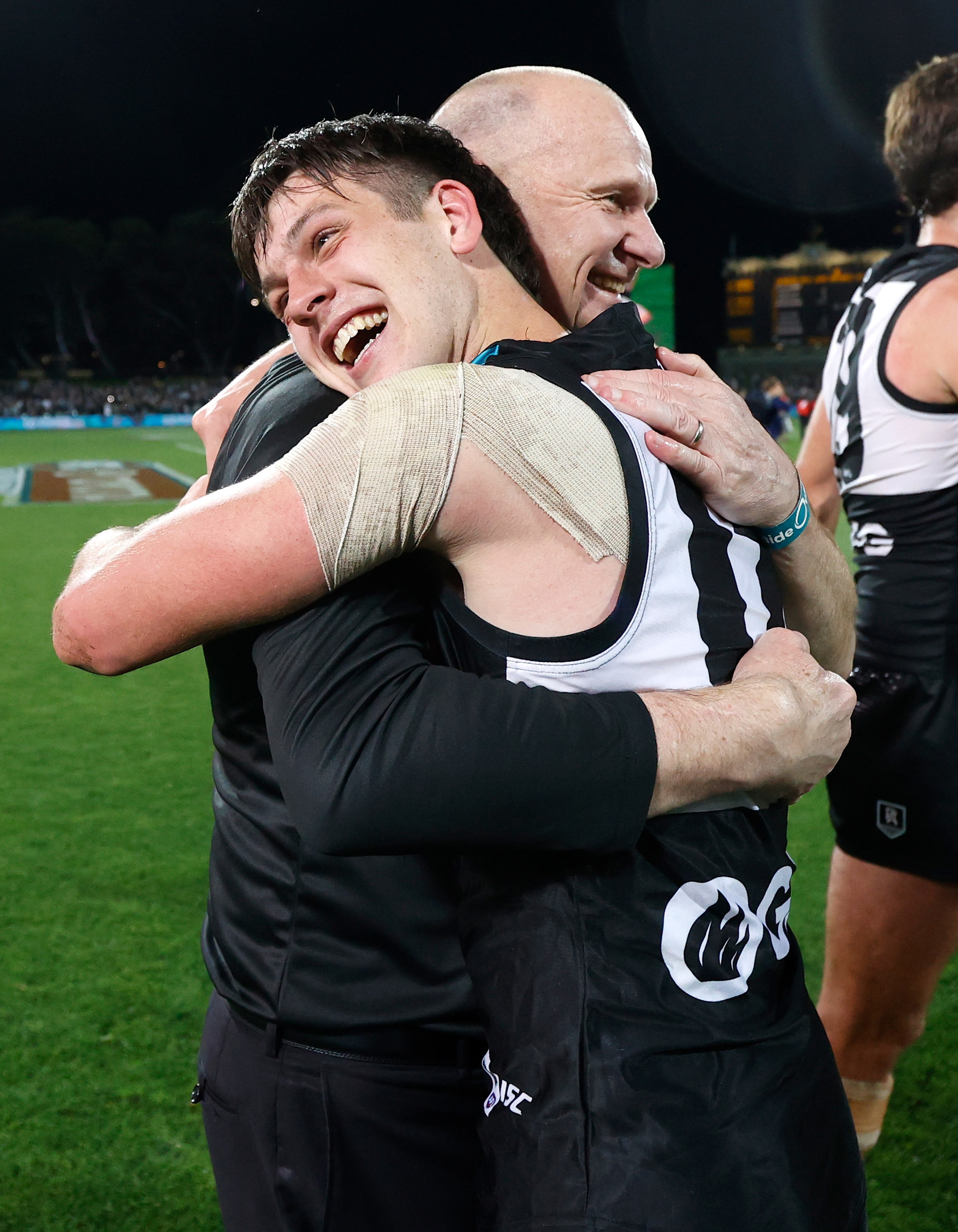 Ken Hinkley, Senior Coach of the Power and Zak Butters celebrate during the 2020 finals series.