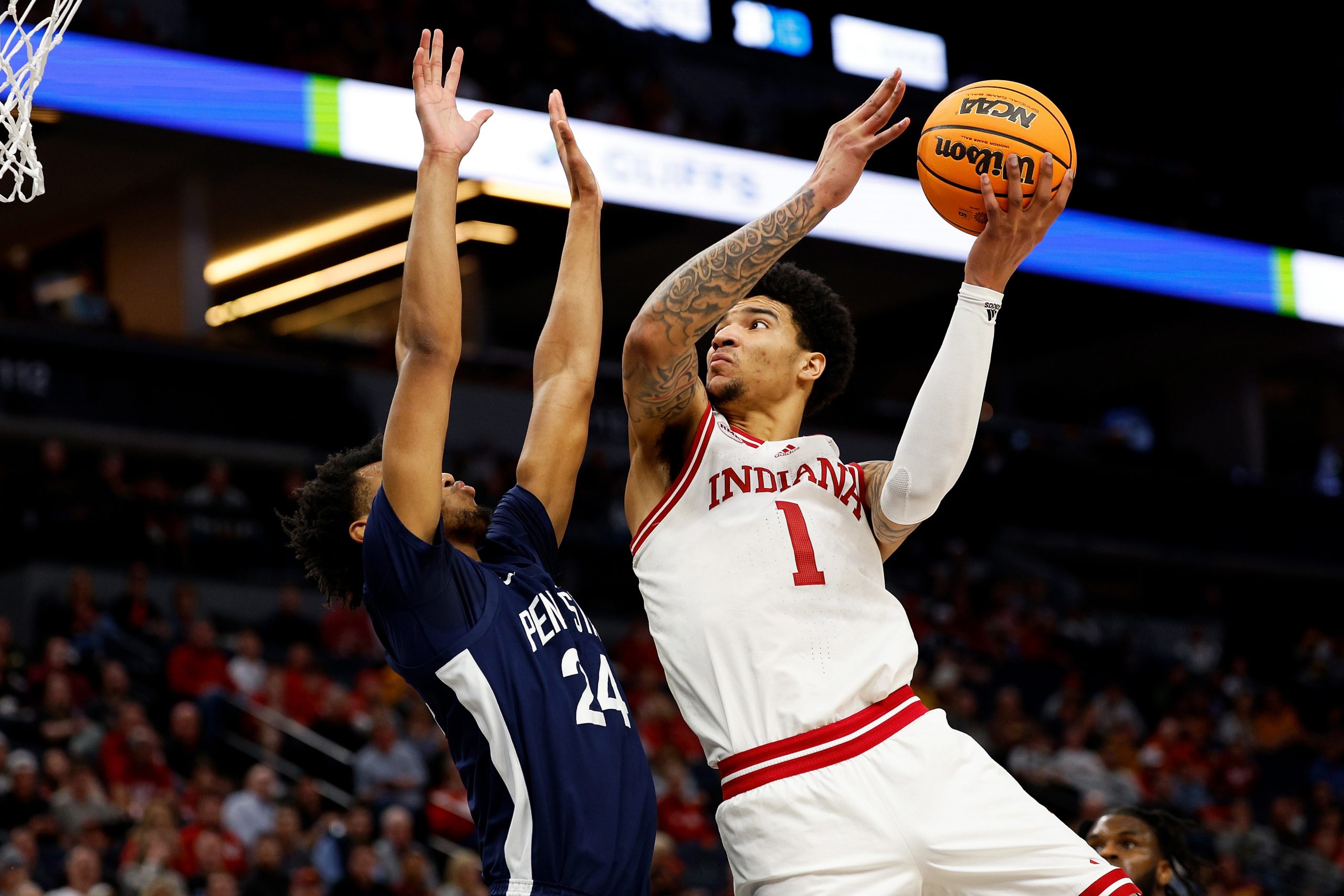 Kel'el Ware of the Indiana Hoosiers goes up for a shot against Zach Hicks of the Penn State Nittany Lions.