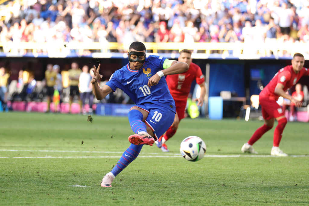 UEFA EURO 2024 group stage match between France and Poland. Kylian Mbappe scores the opening goal from the penalty spot.