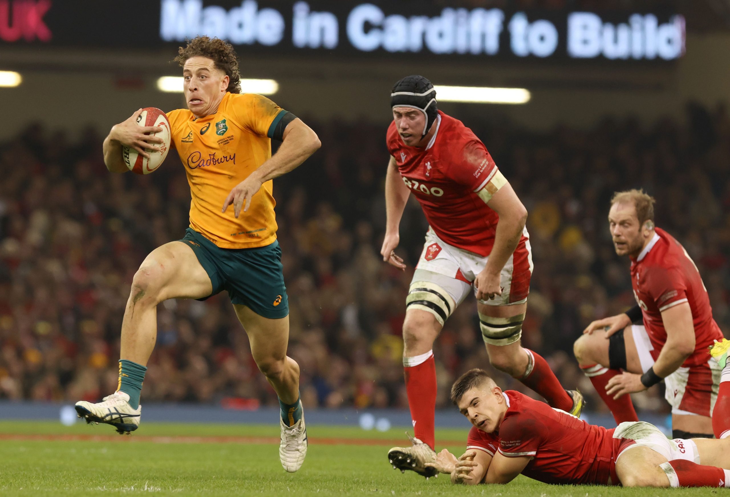 Mark Nawaqanitawase of Australia runs with the ball.