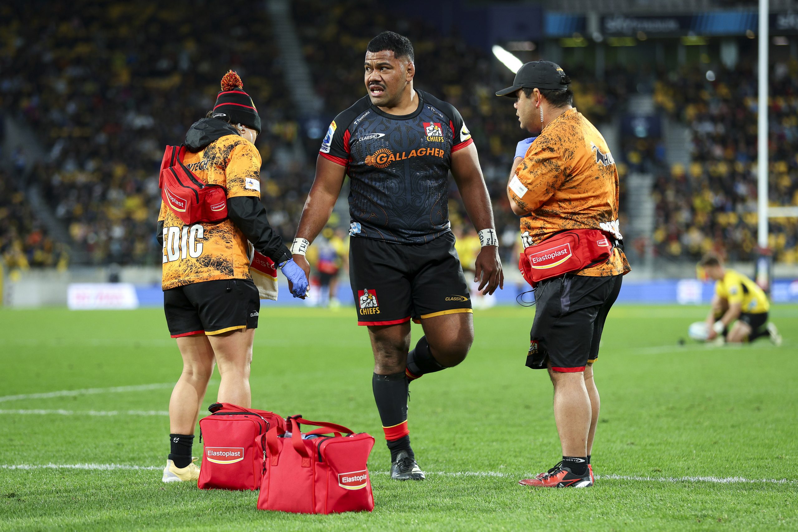 Samisoni Taukeiaho of the Chiefs receives medical attention for an injury during the Super Rugby Pacific semi-final.