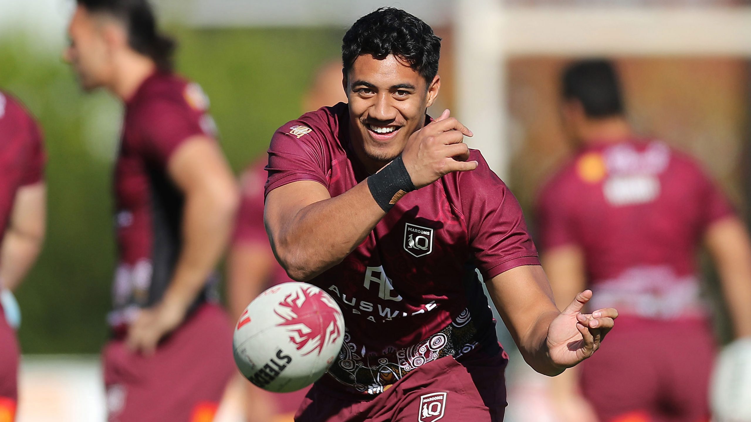 Murray Taulagi passes the ball at Maroons training in 2022.