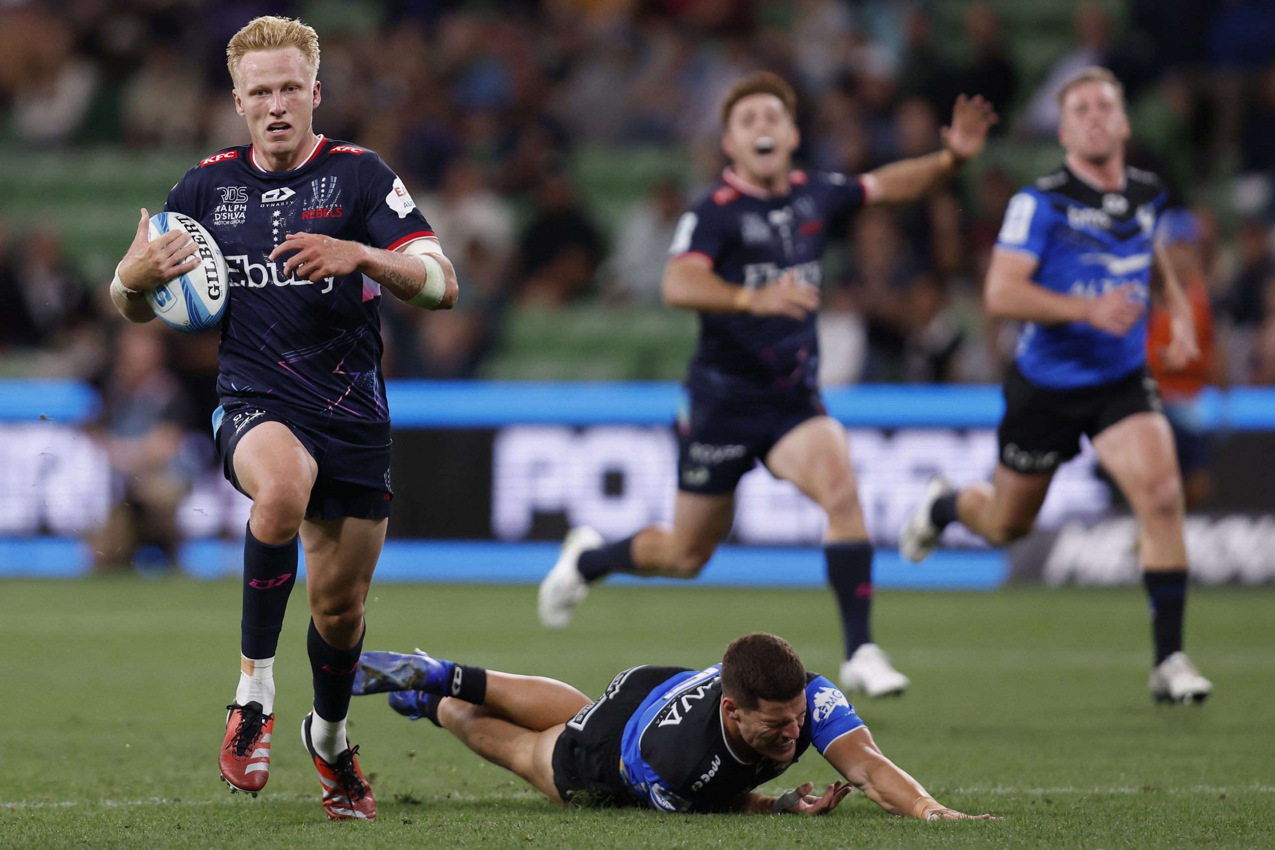 Carter Gordon of the Rebels scores a try.