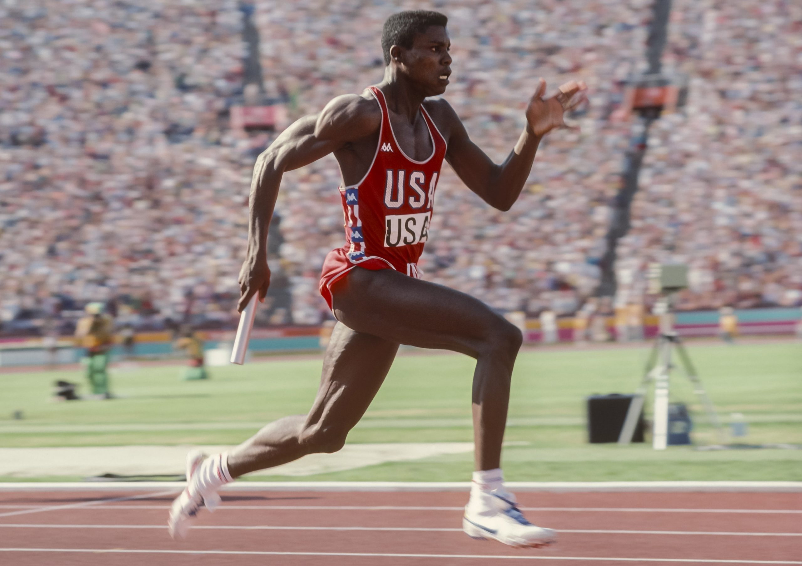 Carl Lewis anchoring the USA's men's 4x100m relay team to gold in world record time in Los Angeles.