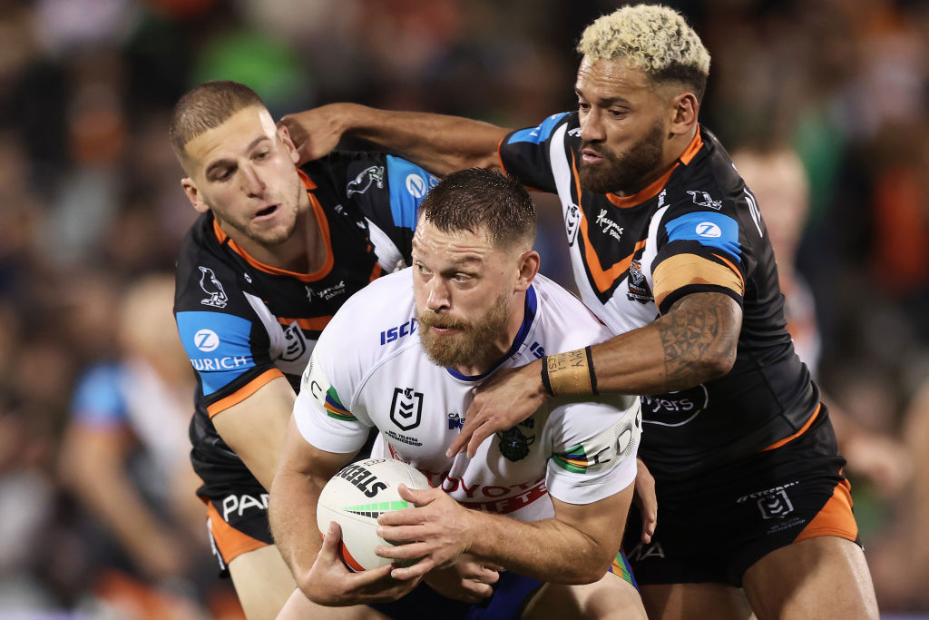 Elliott Whitehead tackled by the Wests Tigers.