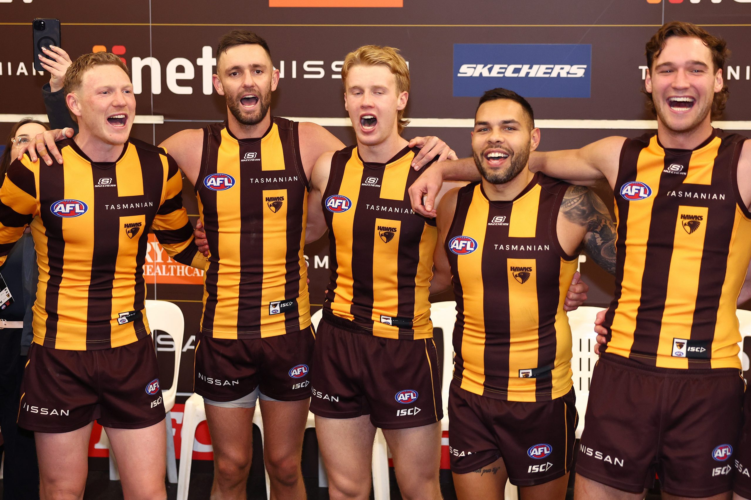 Hawthorn players singing the song after their win over the Crows.