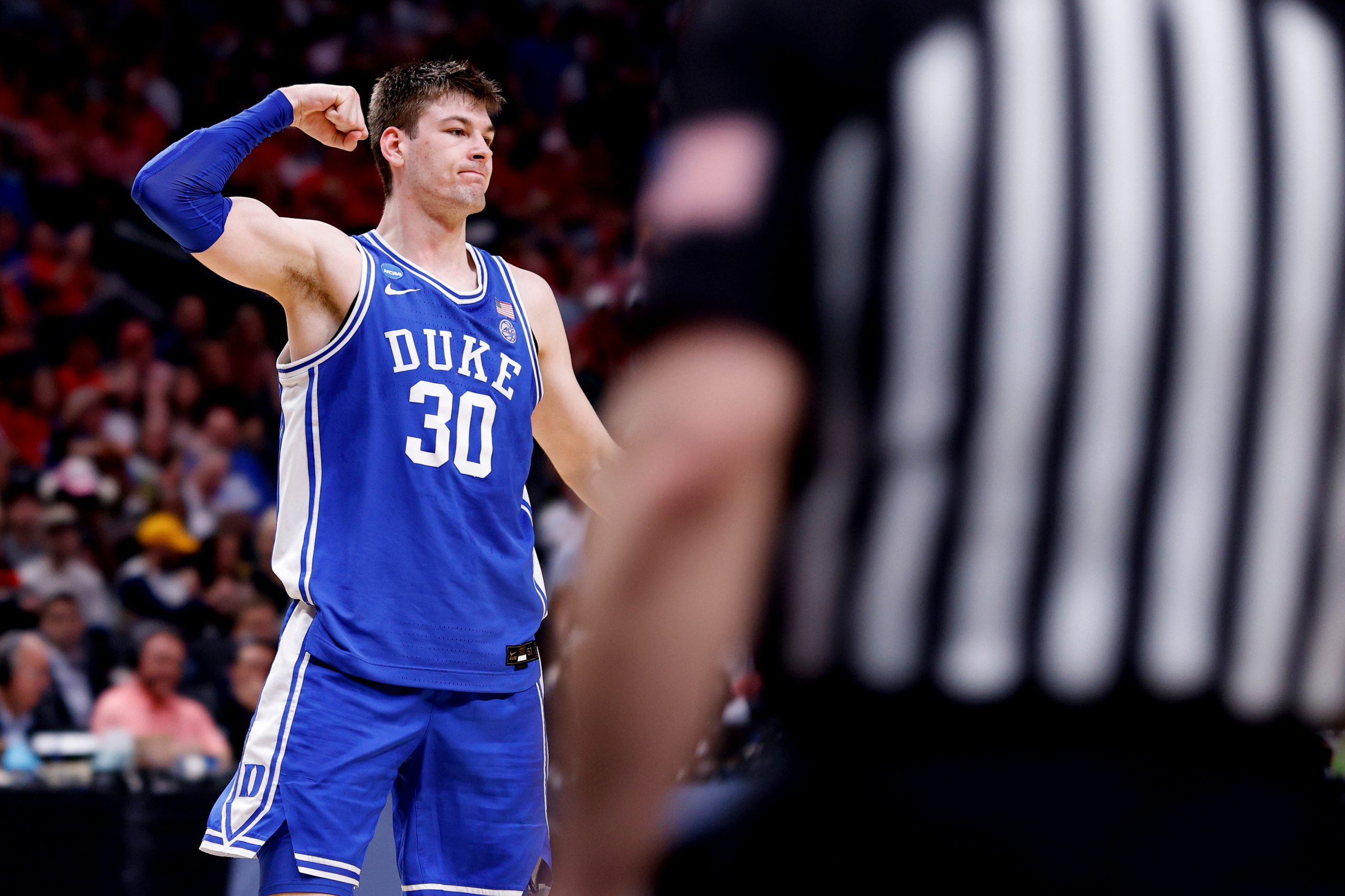 Kyle Filipowski of the Duke Blue Devils reacts following a basket and drawing foul.