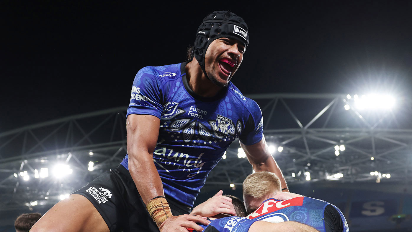 Stephen Crichton celebrates a try with Bulldogs teammates during their round 12 win over the Dragons.