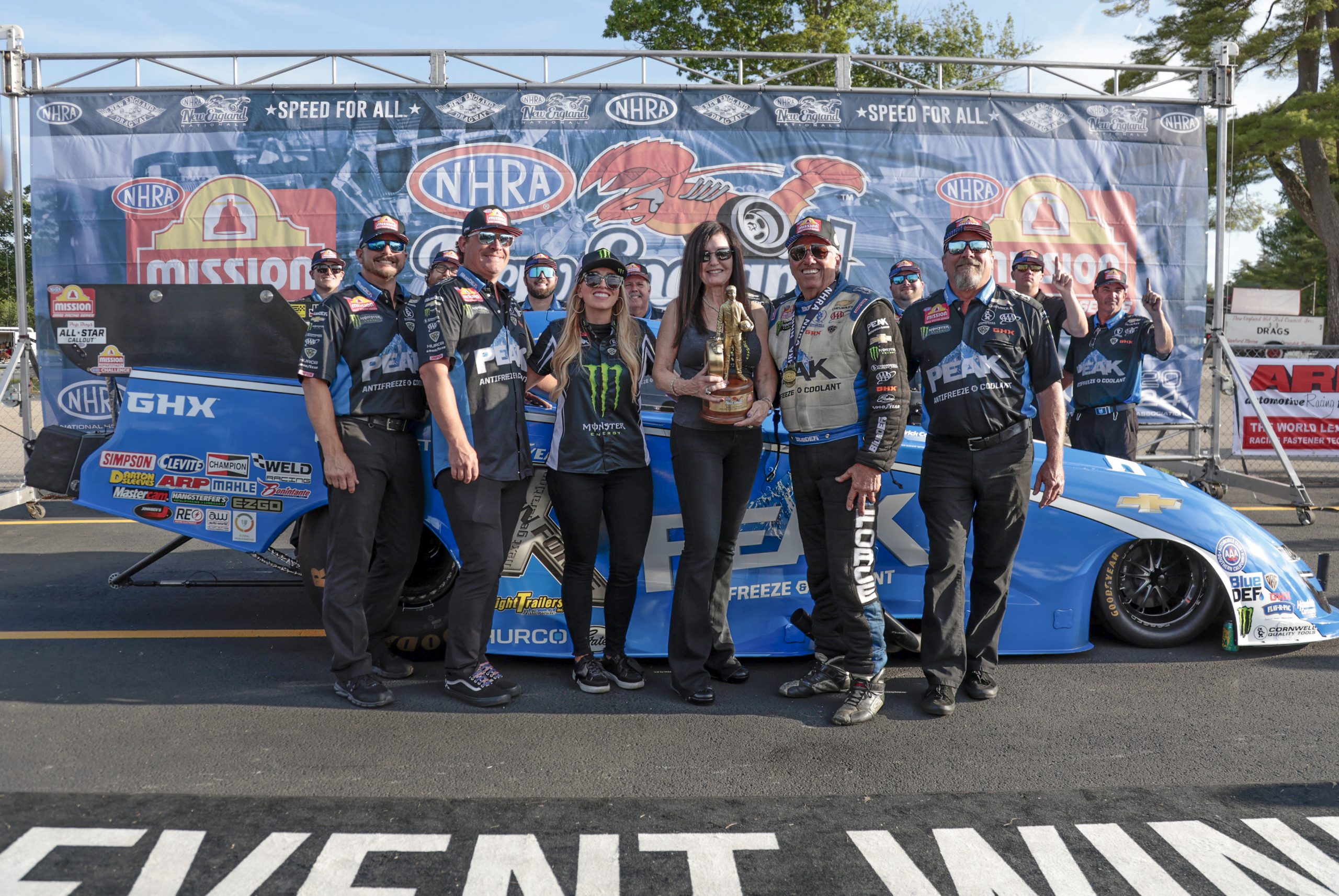 Funny Car winner John Force, of Yorba Linda, CA, driving a JFR 500 Peak Chevy '22 Camaro SS with team after the NHRA New England Nationals on June 2, 2024, at New England Dragway in Epping, New Hampshire. (Photo by Fred Kfoury III/Icon Sportswire via Getty Images)