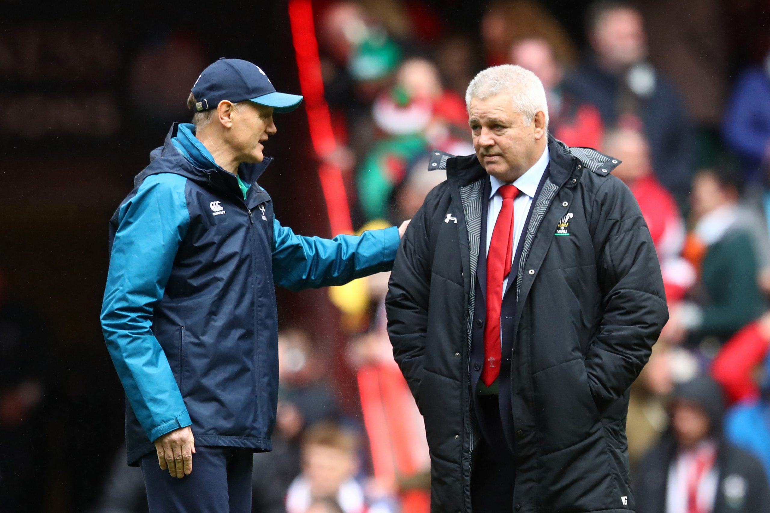 Joe Schmidt speaks with Warren Gatland prior to a Six Nations match.