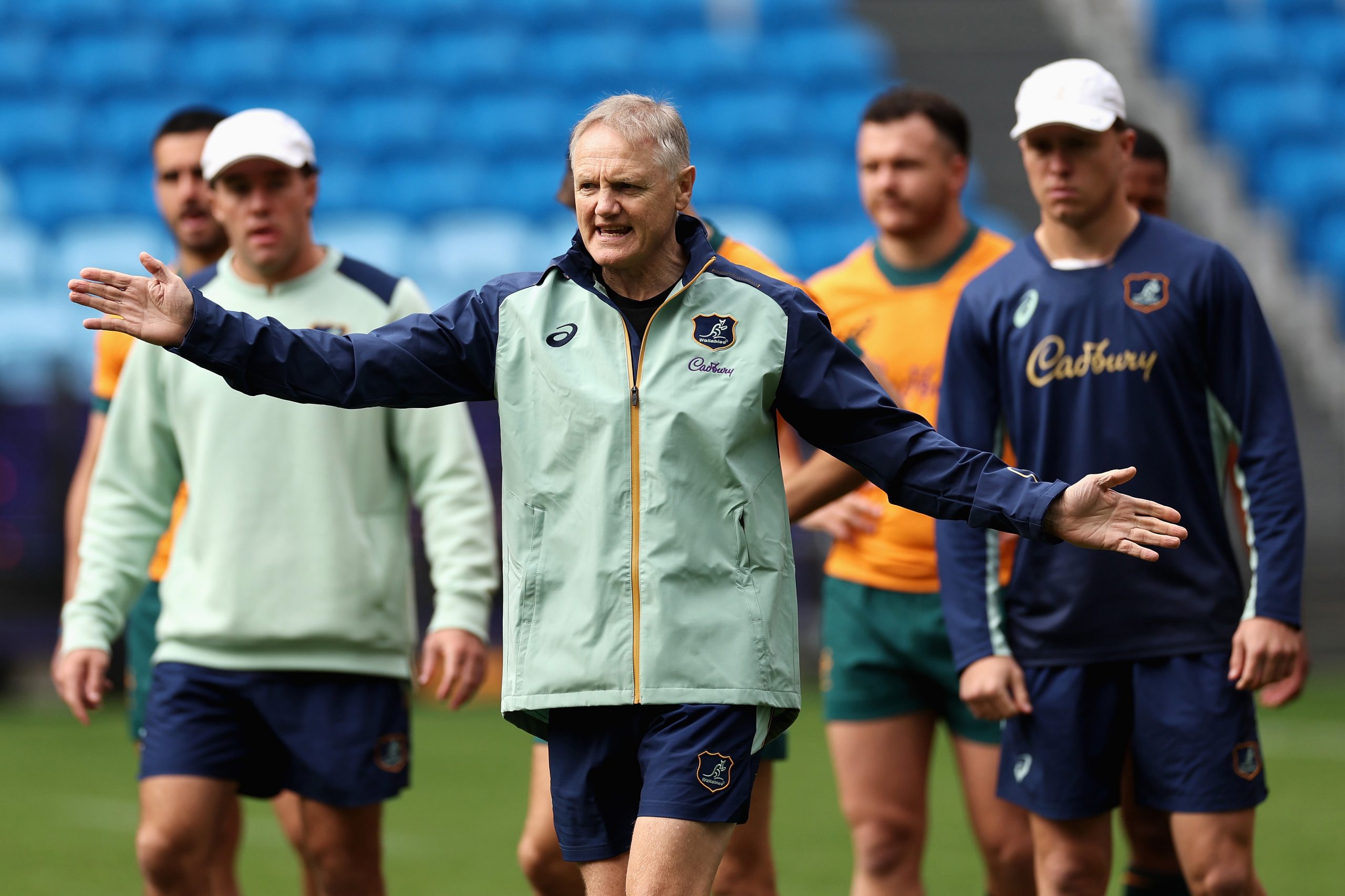 Wallabies coach Joe Schmidt talks to players at Allianz Stadium.