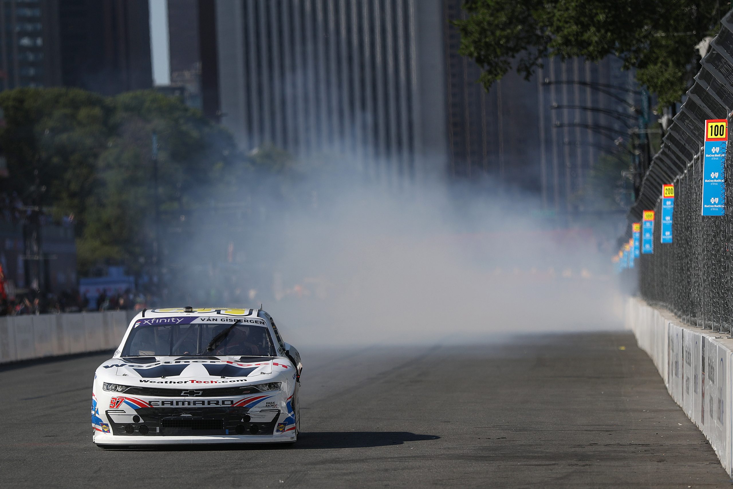 Shane Van Gisbergen, driver of the #97 WeatherTech Chevrolet, celebrates with a burnout after winning the NASCAR Xfinity Series The Loop 110 at Chicago Street Course on July 06, 2024 in Chicago, Illinois. (Photo by Meg Oliphant/Getty Images)