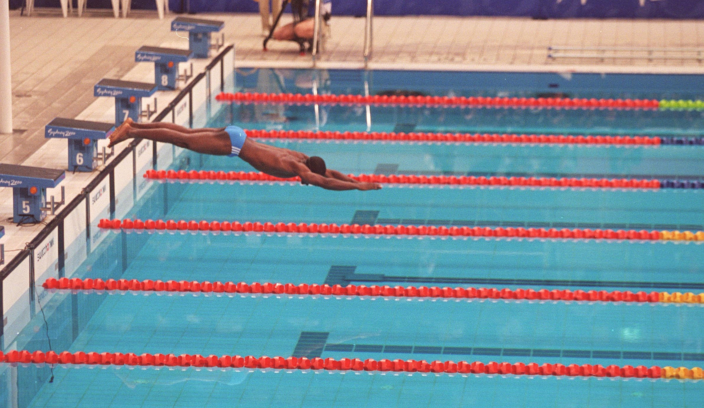 Eric Moussambani dives from the blocks.