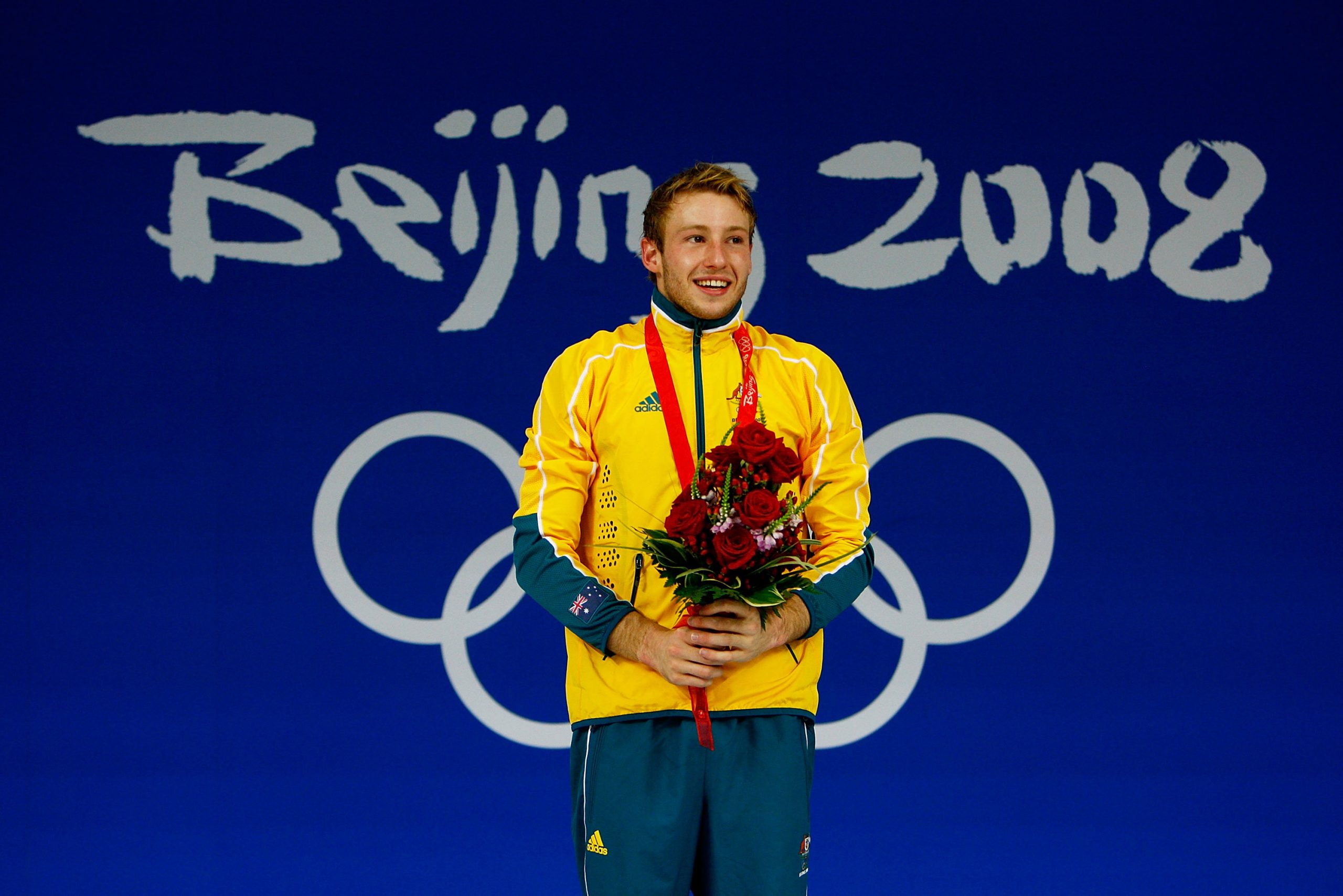 Matthew Mitcham beams with delight at the medal ceremony.