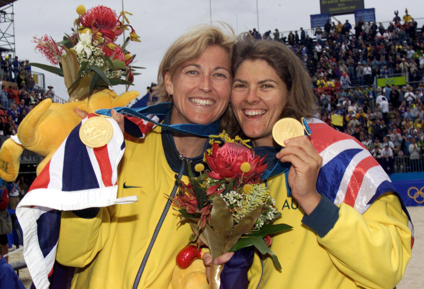 Kerri Pottharst (left) and Natalie Cook celebrate becoming Olympic champions.