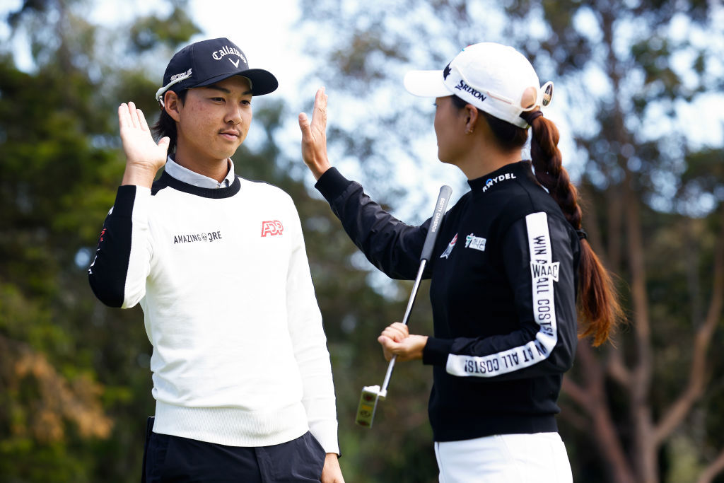 Minjee Lee and Min Woo Lee high five.