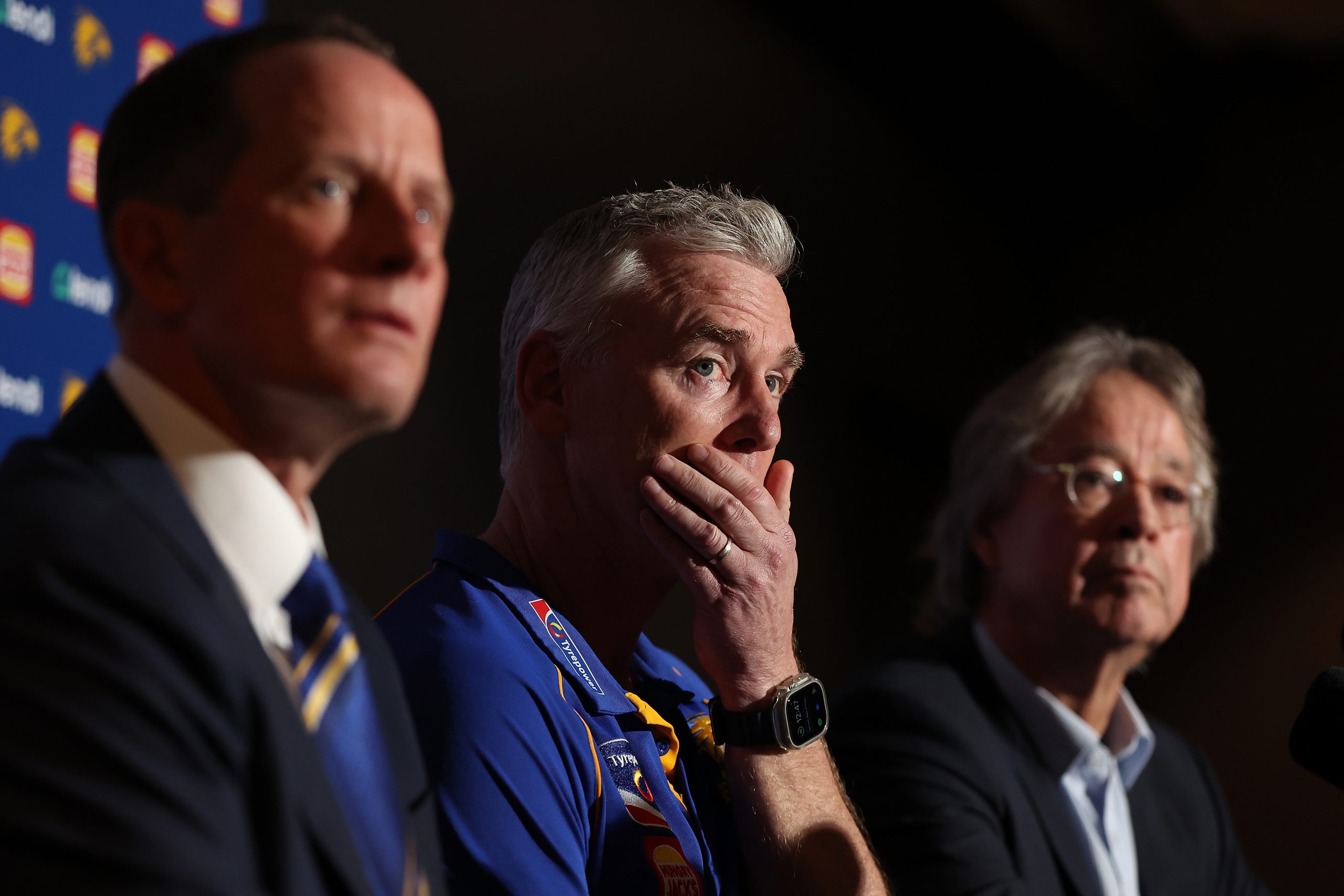 Adam Simpson looks on with Don Pyke and Paul Fitzpatrick during his final press conference.