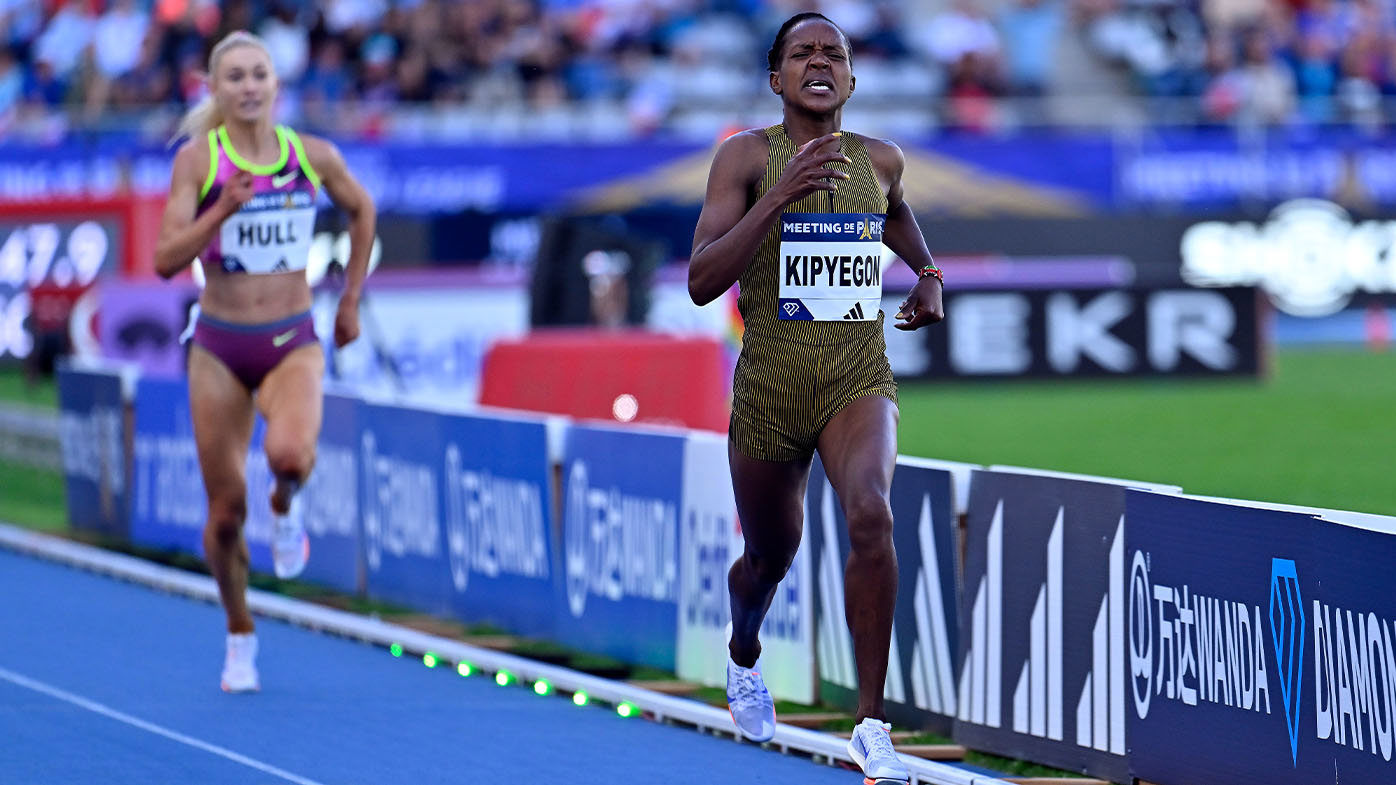 Kenyan Faith Kipyegon charging to victory in world record time.