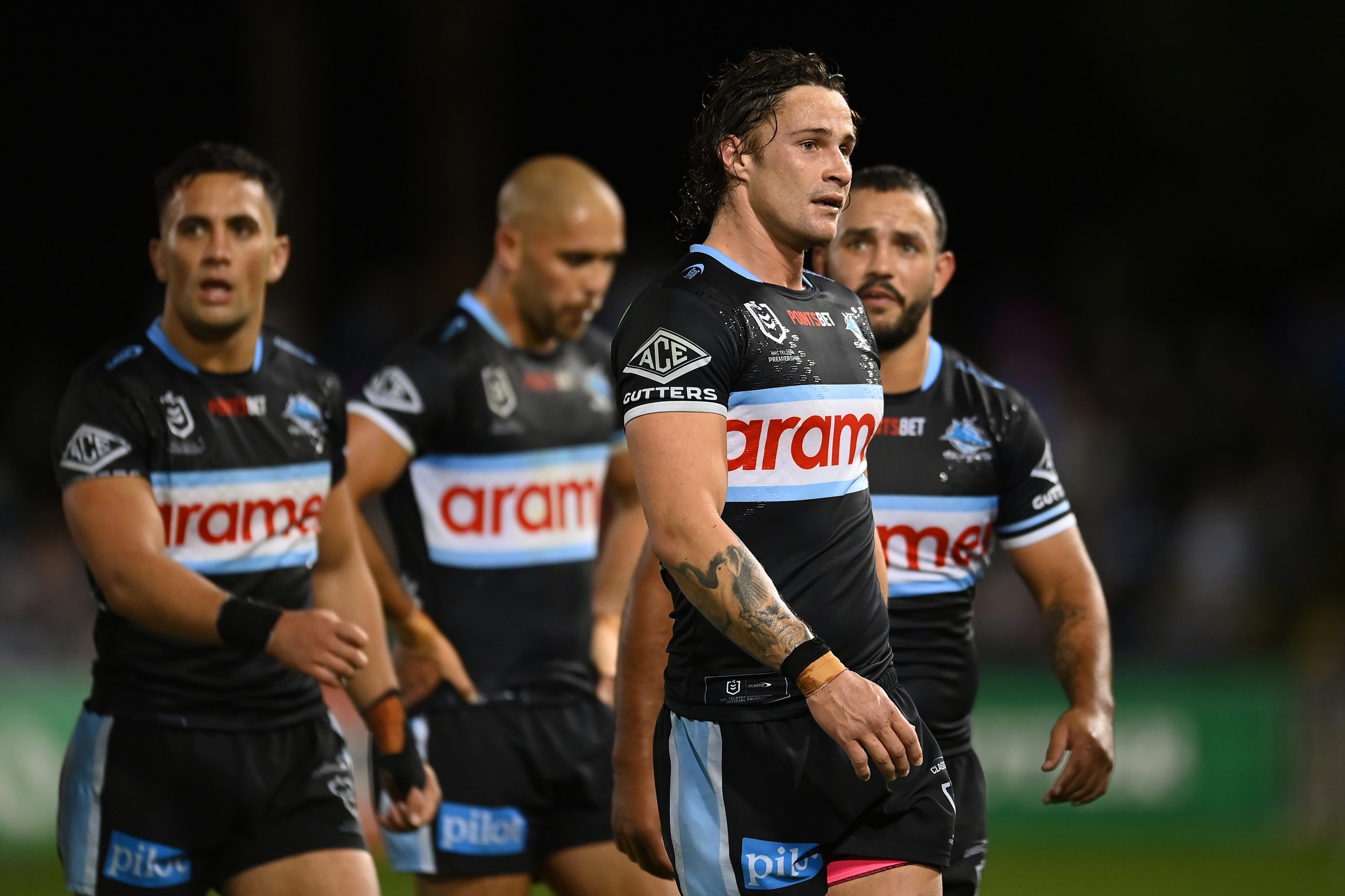 Members of the Cronulla Sharks react during their round 18 match against the Gold Coast Titans.