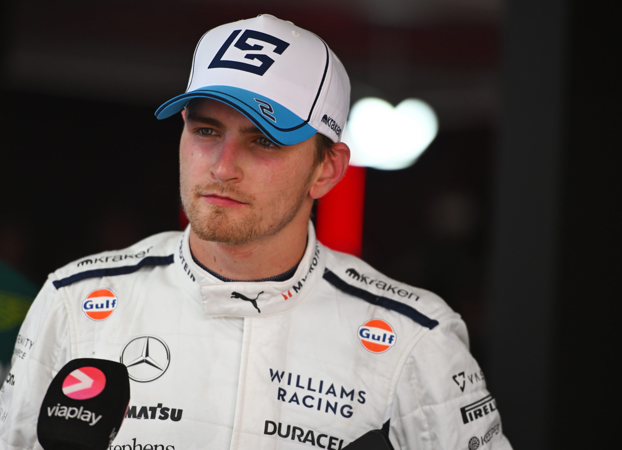 Logan Sargeant of Williams talks to the media in the paddock after Austrian Grand Prix at the Red Bull Ring.