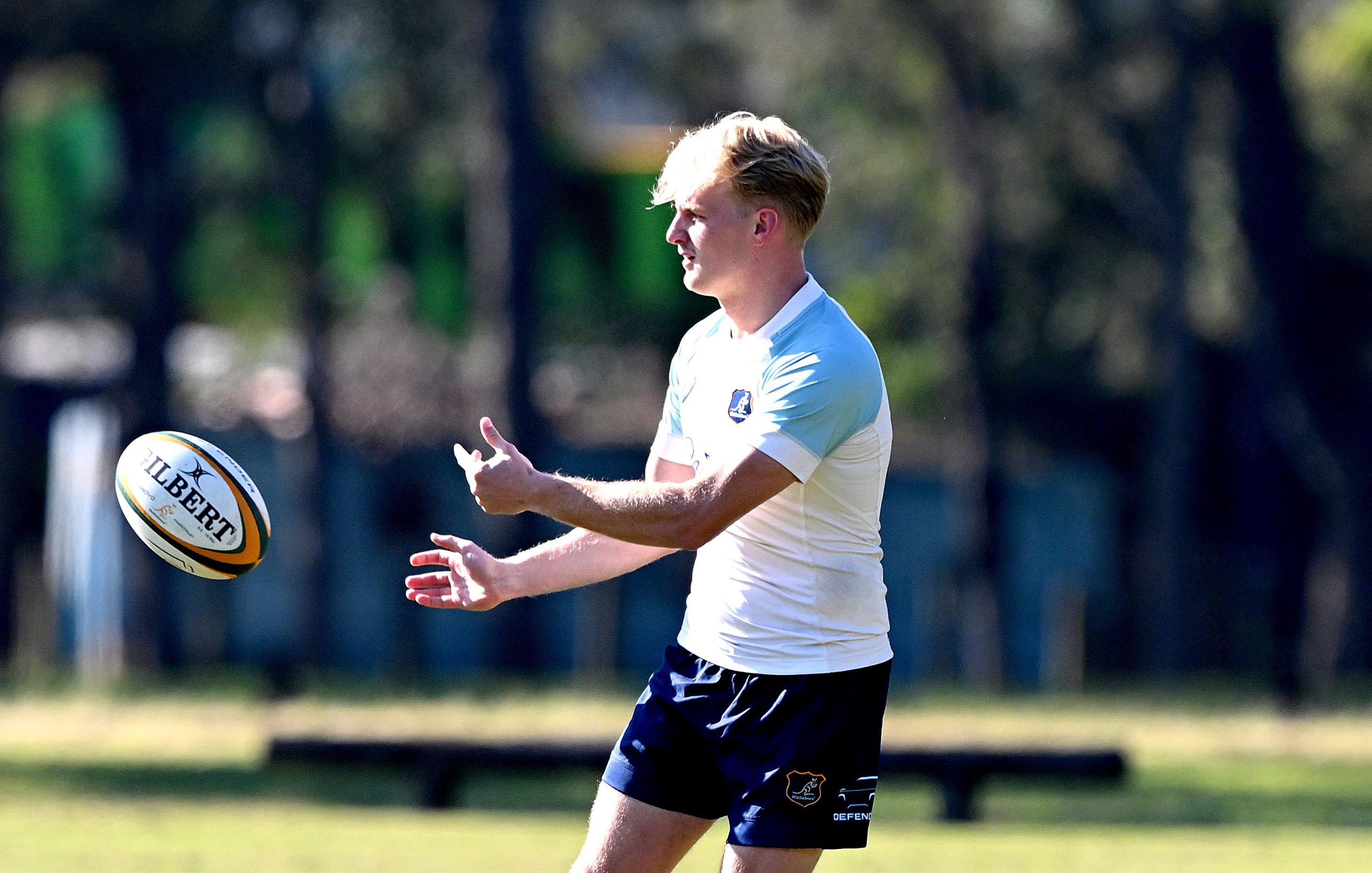 Tom Lynagh passes the ball during a Wallabies training session at Ballymore Stadium.