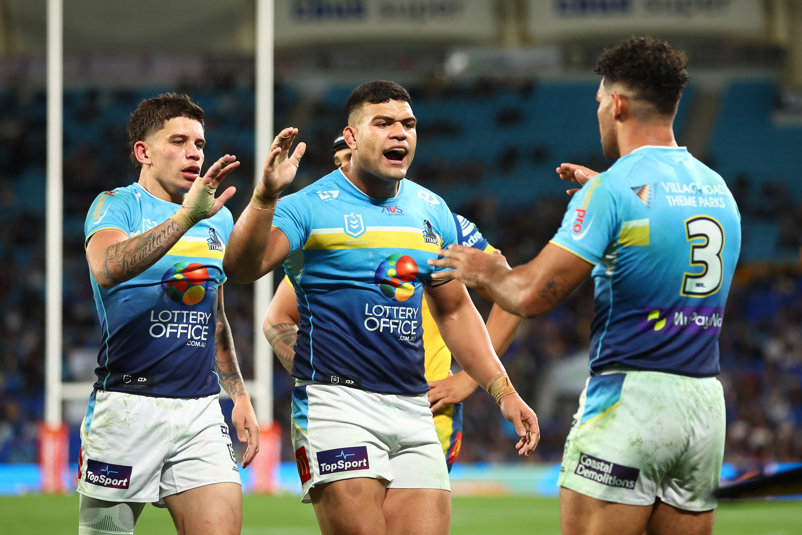 Jayden Campbell and David Fifita celebrates a try by teammate Brian Kelly during the Titans' win over the Eels.