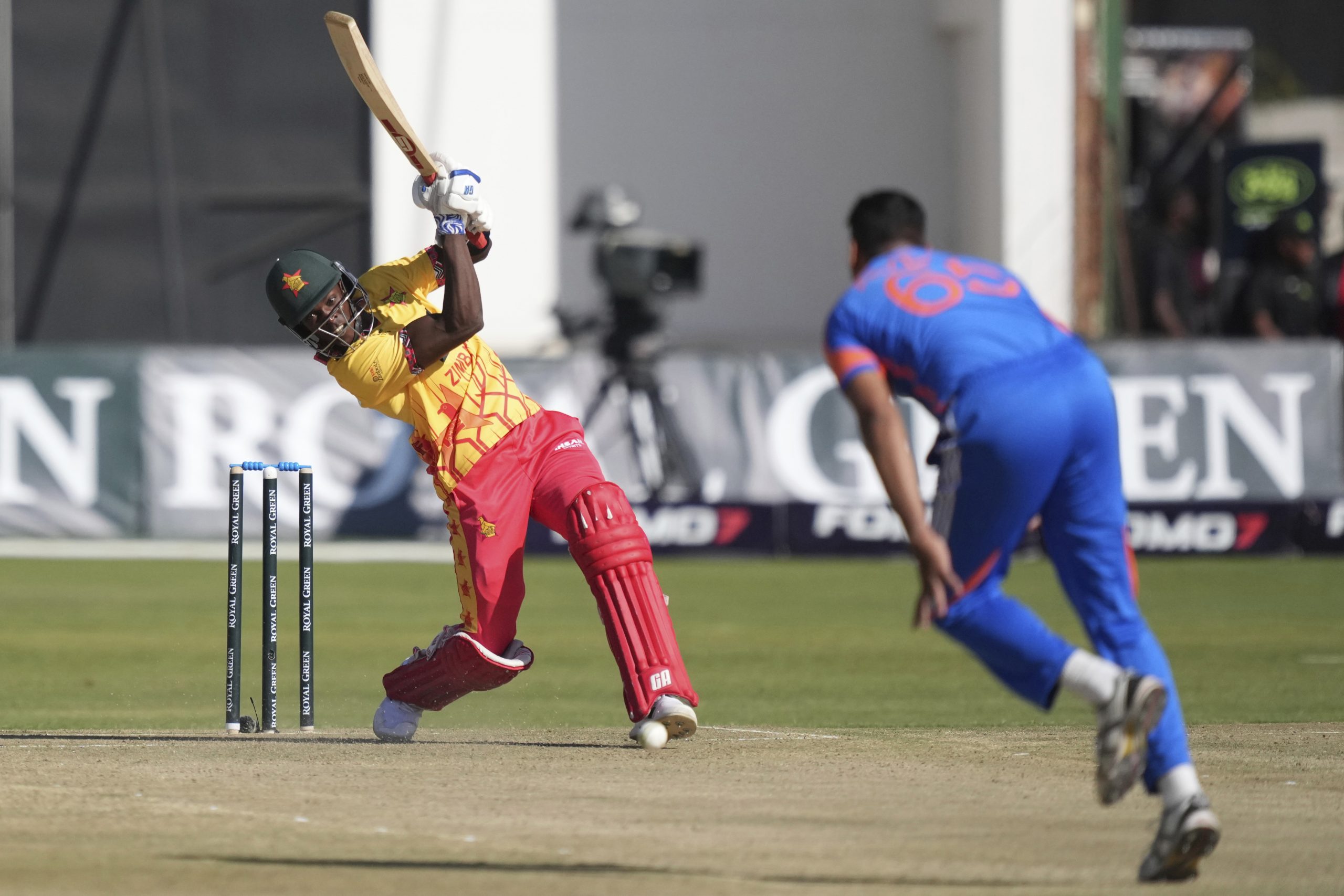 Zimbabwe's batsman Clive Madande, left, plays a shot during the T20 cricket match against India at Harare Sports club, Saturday, July 6, 2024. (AP Photo/Tsvangirayi Mukwazhi)