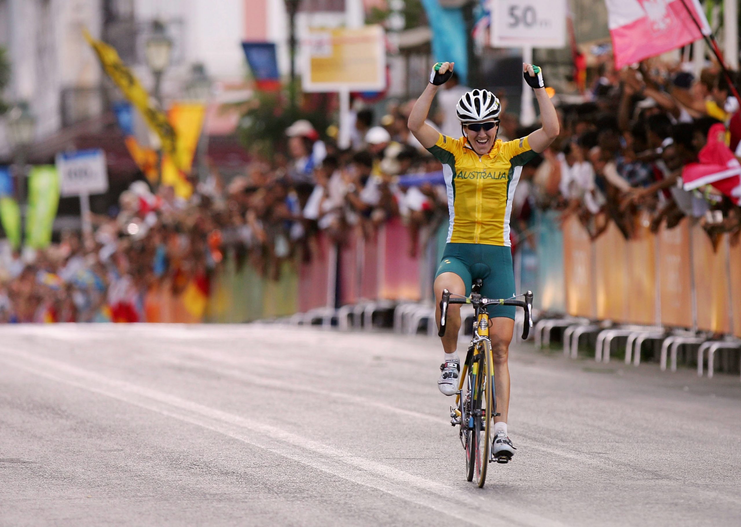 Australian cyclist Sara Carrigan celebrates winning Olympic gold at the Athens 2004 Games.