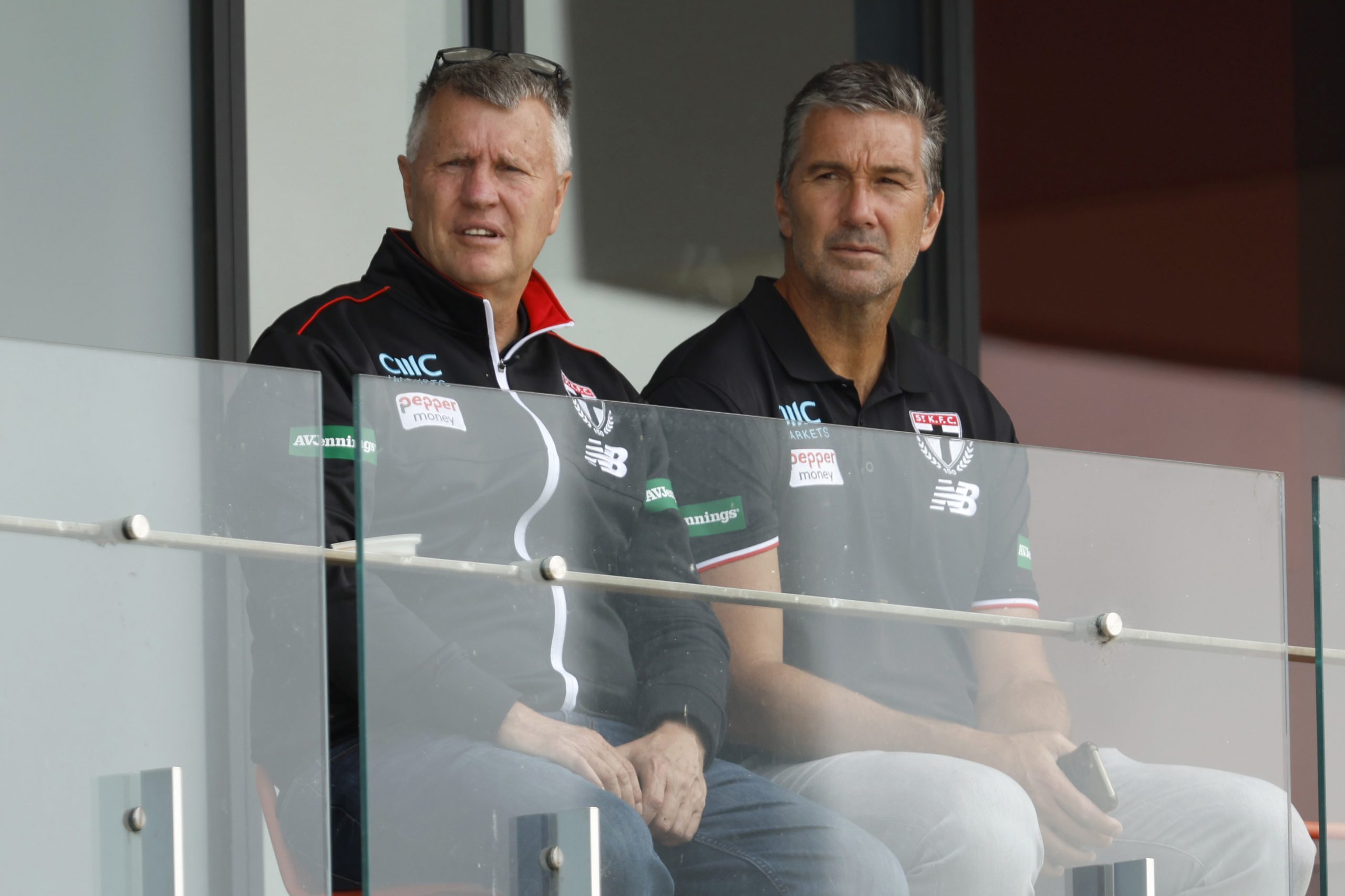 Head of Talent and Acquisition, Graeme Allan and  List Manager Stephen Silvagni look on during a St Kilda training session in February 2024.