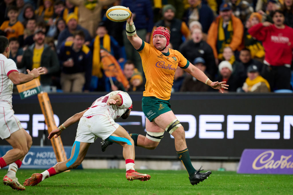 Harry Wilson offloads against Georgia.