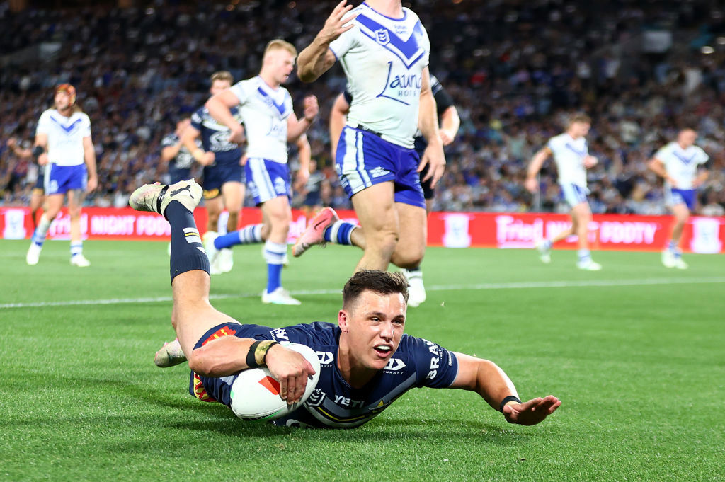 Scott Drinkwater of the Cowboys scores a try during the round 27 NRL match between Canterbury Bulldogs and North Queensland Cowboys.