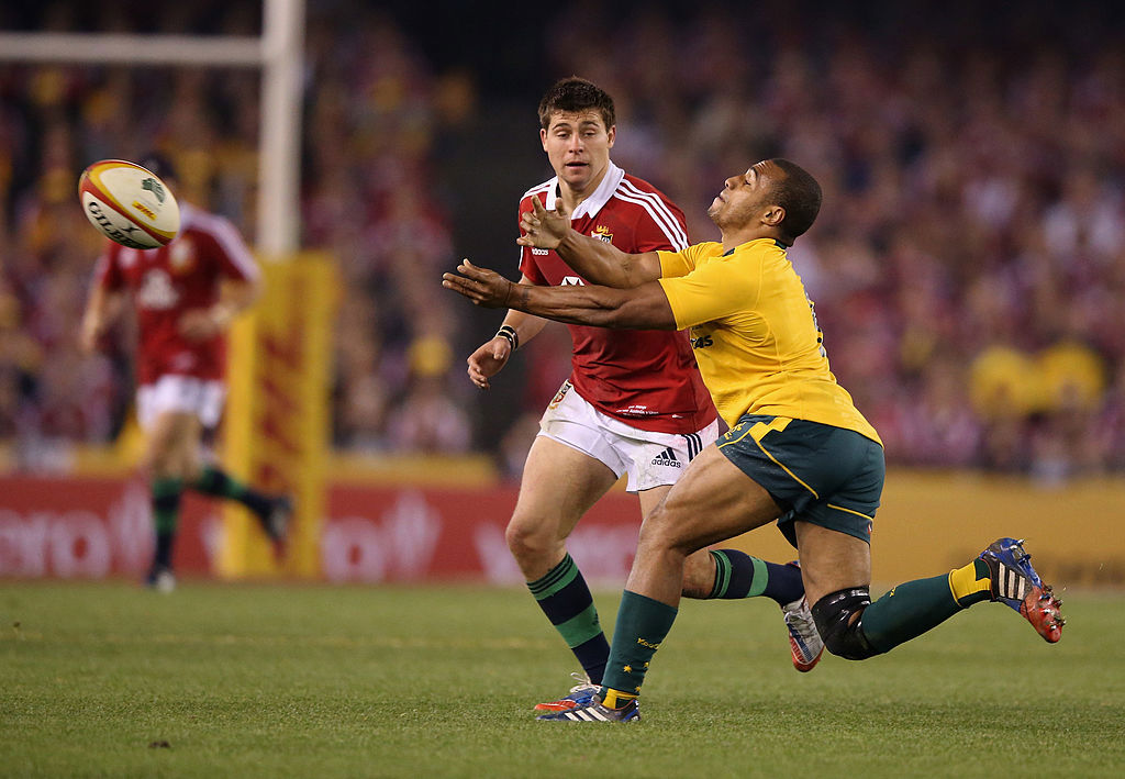 Ben Youngs of the Lions applies pressure on Australia's Will Genia in 2013 in Melbourne.