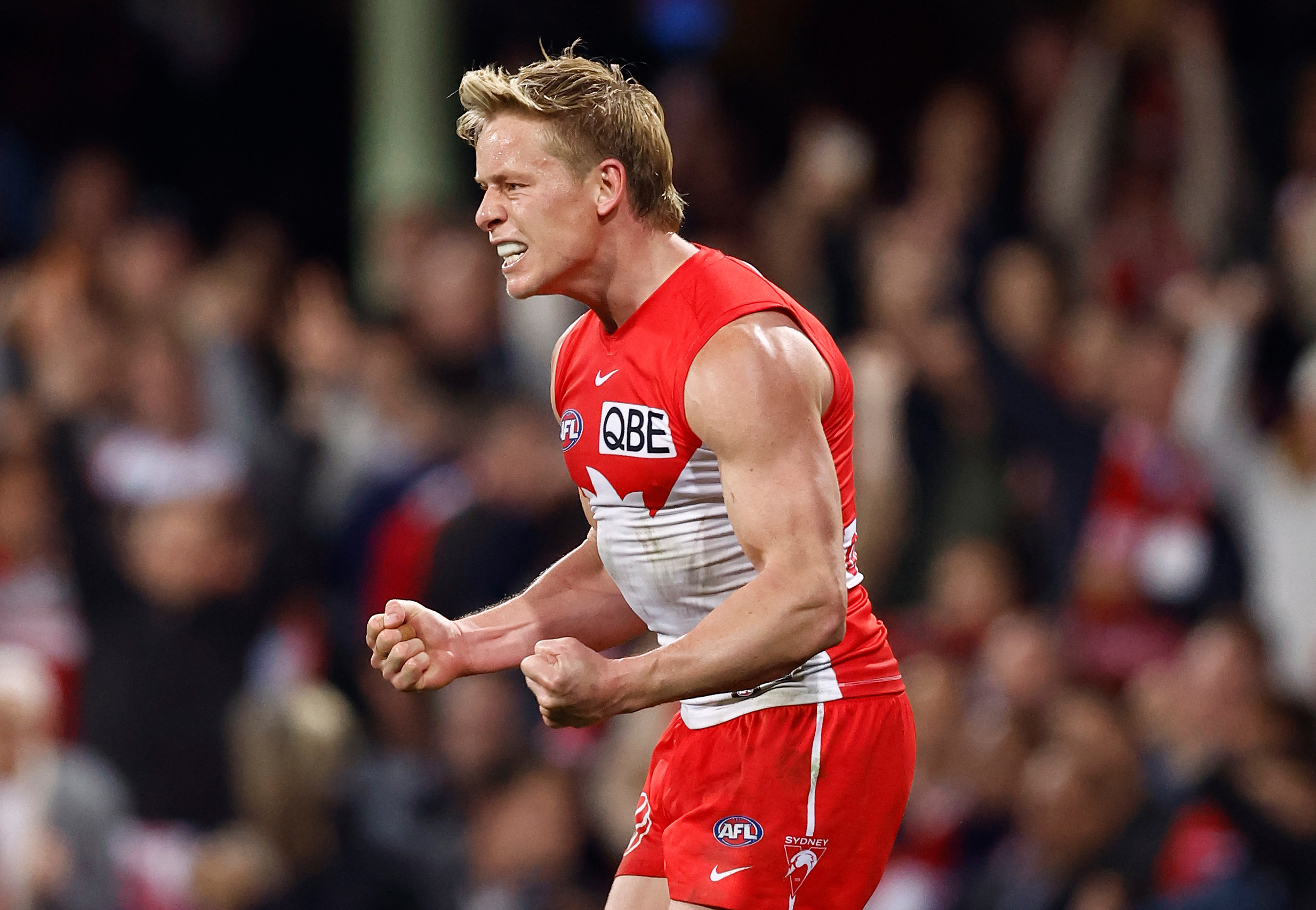 Isaac Heeney of the Swans celebrates his fourth term goal to help Sydney defeat Collingwood in round 22, 2024.