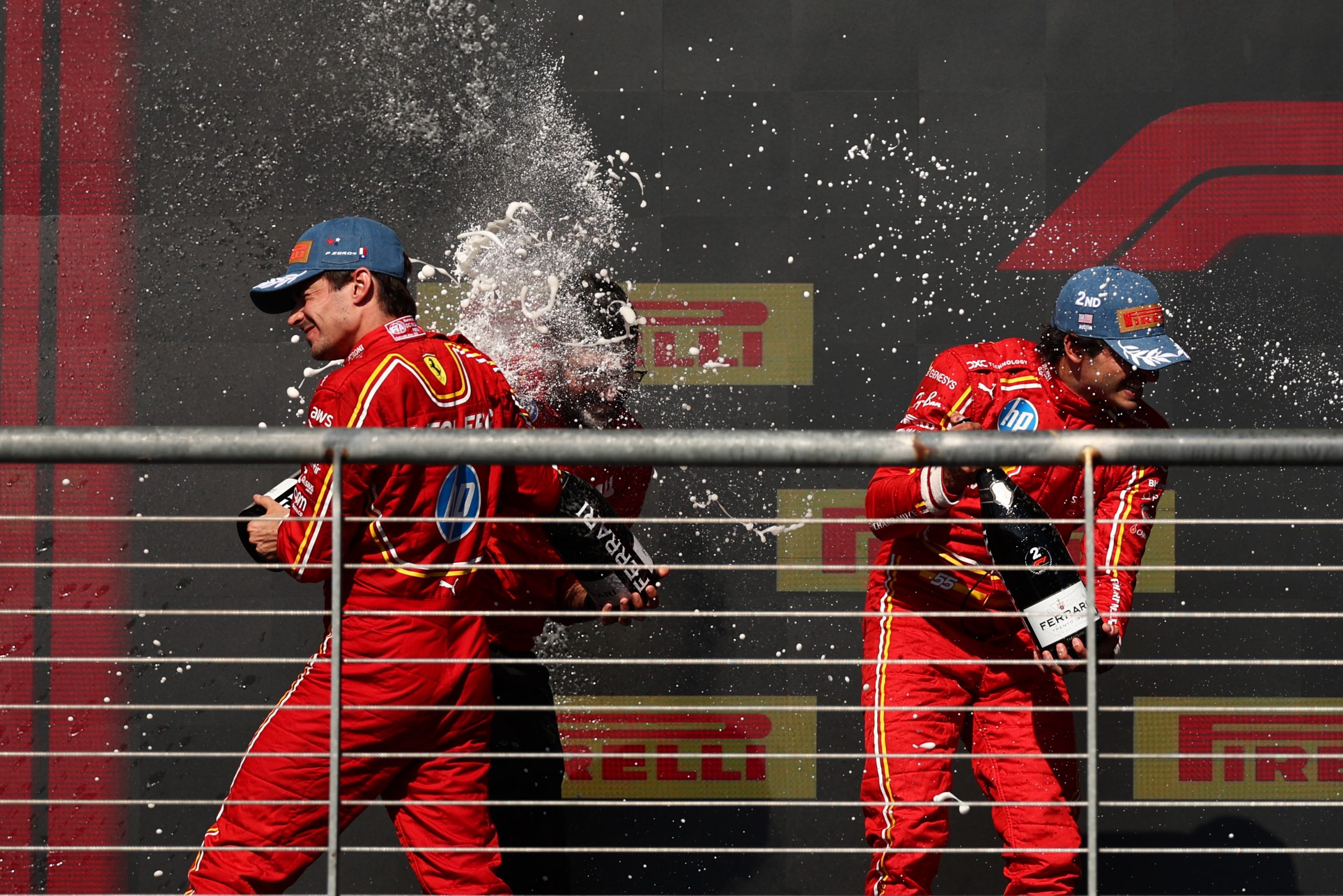 Race winner Charles Leclerc of Monaco and Ferrari and Second placed Carlos Sainz of Spain and Ferrari celebrate on the podium after the F1 Grand Prix of United States at Circuit of The Americas on October 20, 2024 in Austin, Texas. (Photo by Jared C. Tilton/Getty Images)