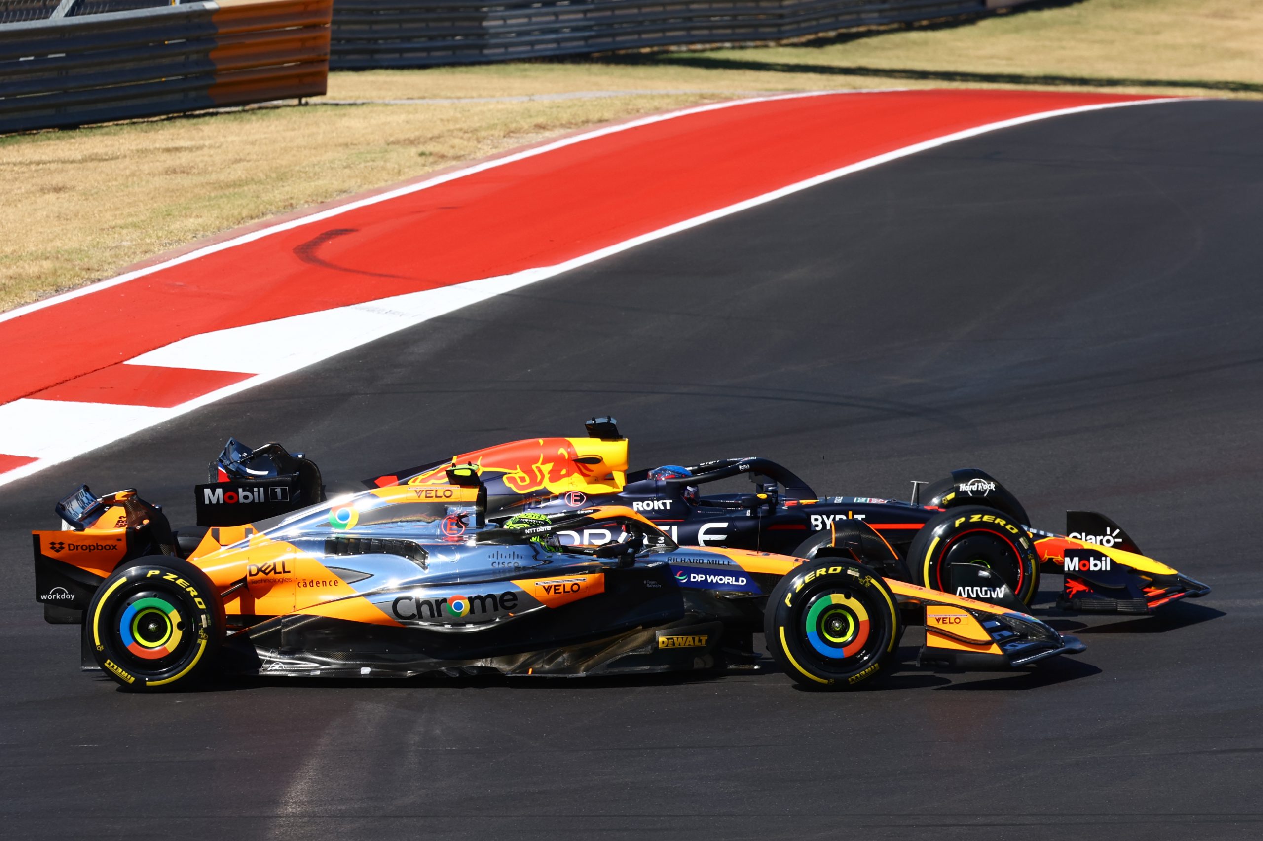 Max Verstappen of the Netherlands driving the (1) Oracle Red Bull Racing RB20 and Lando Norris of Great Britain driving the (4) McLaren MCL38 Mercedes battle for position during the F1 Grand Prix of United States at Circuit of The Americas on October 20, 2024 in Austin, Texas. (Photo by Mark Thompson/Getty Images)