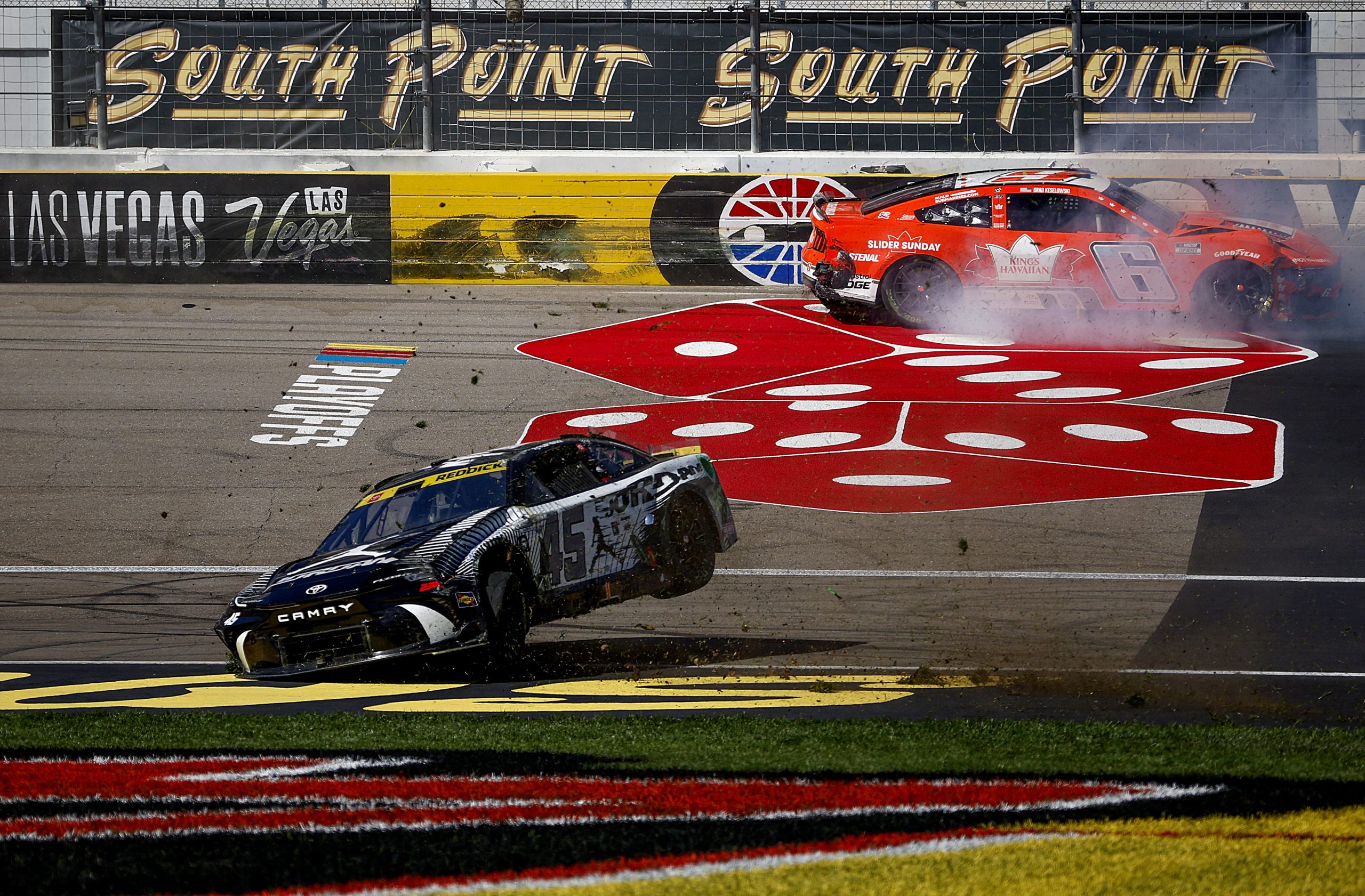 Tyler Reddick, driver of the #45 Jordan Brand Toyota, and Brad Keselowski, driver of the #6 King's Hawaiian Ford, spin after an on-track incident during the NASCAR Cup Series South Point 400 at Las Vegas Motor Speedway on October 20, 2024 in Las Vegas, Nevada. (Photo by Sean Gardner/Getty Images)