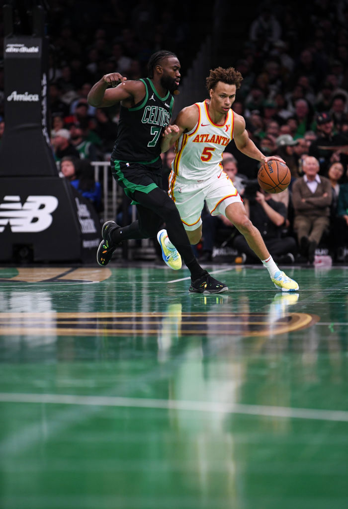 Dyson Daniels of the Atlanta Hawks brings the ball up court against Jaylen Brown of the Boston Celtics during the first half of their NBA Cup clash.