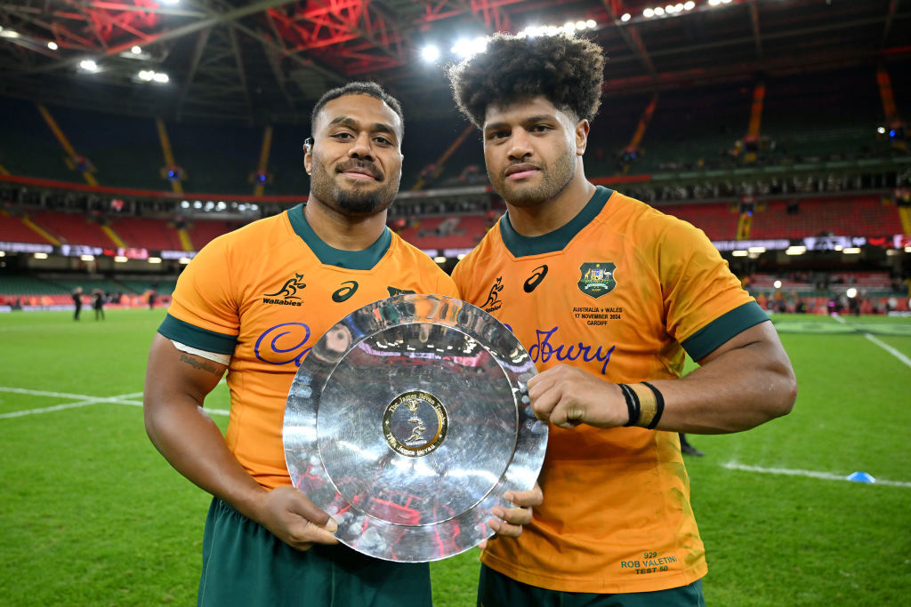 Samu Kerevi and Rob Valetini of Australia pose for a photo with the James Bevan Trophy.