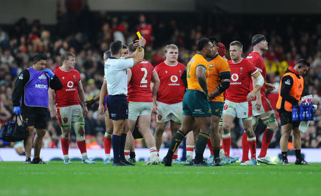 Referee James Doleman shows Australia's Samu Kerevi the yellow card.