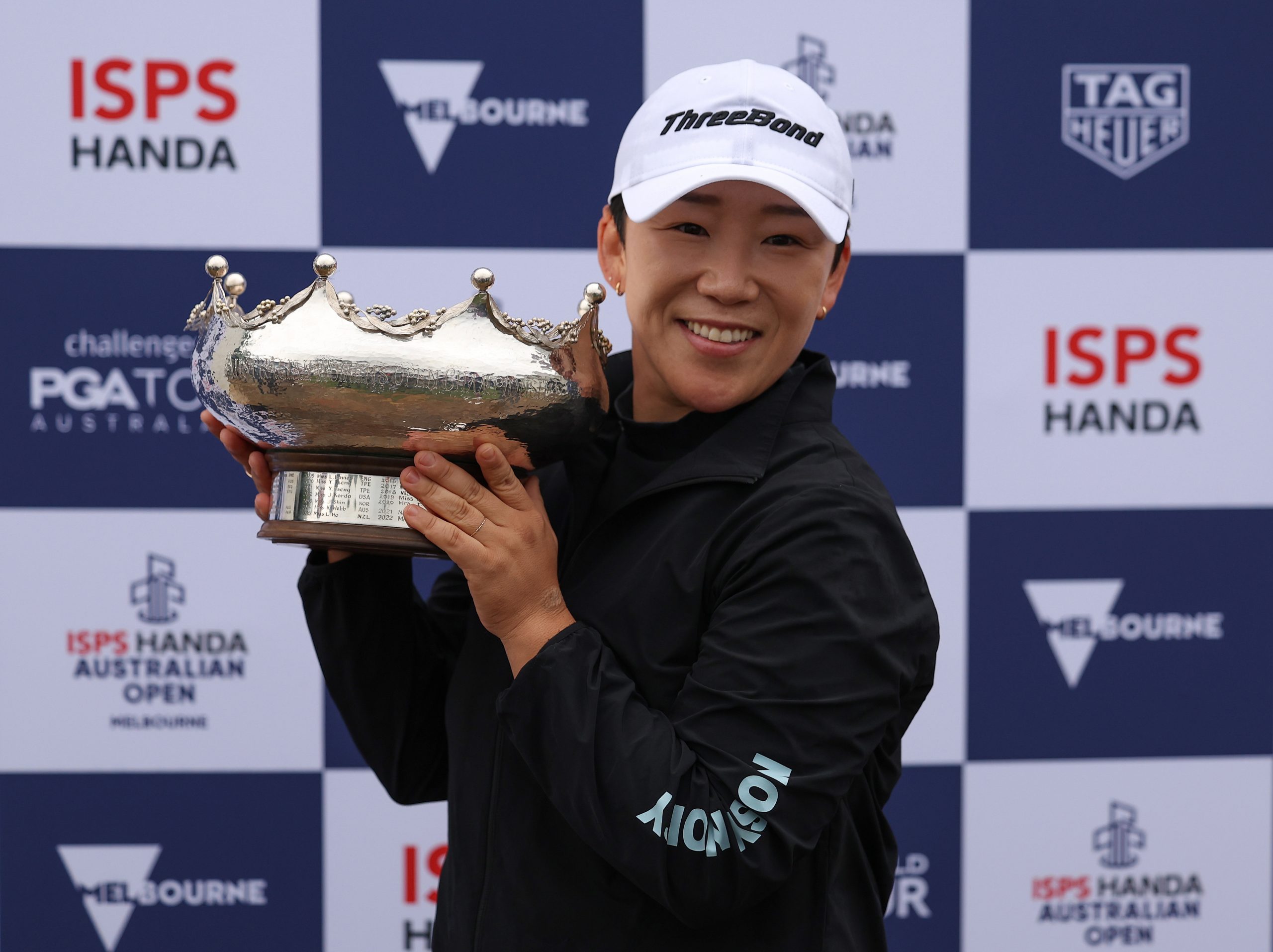 Jiyai Shin poses with the Patricia Bridges Bowl after victory on day four of the Australian Open 2024.