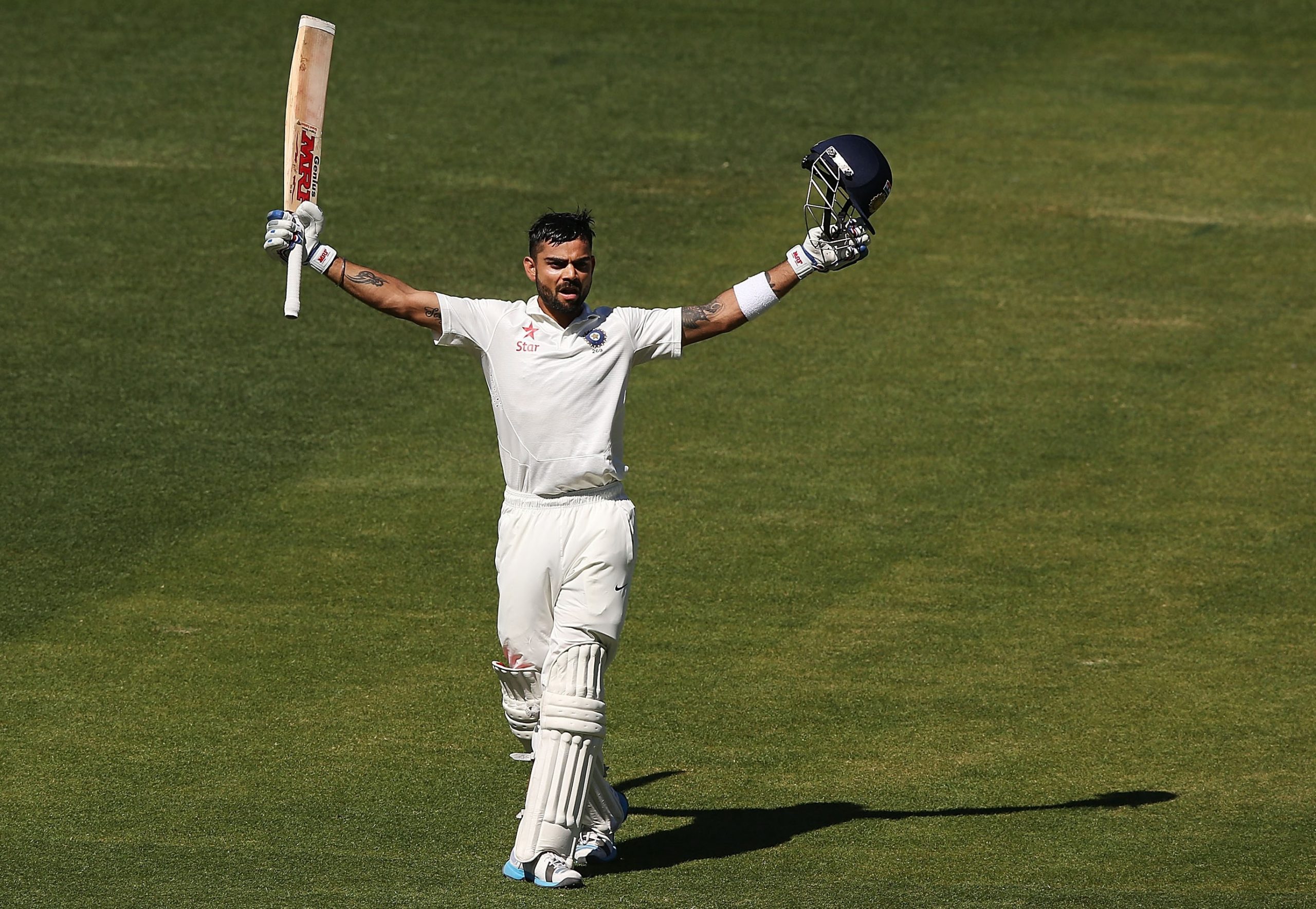 Virat Kohli celebrates scoring his second of two centuries during the 2014 Adelaide Test.